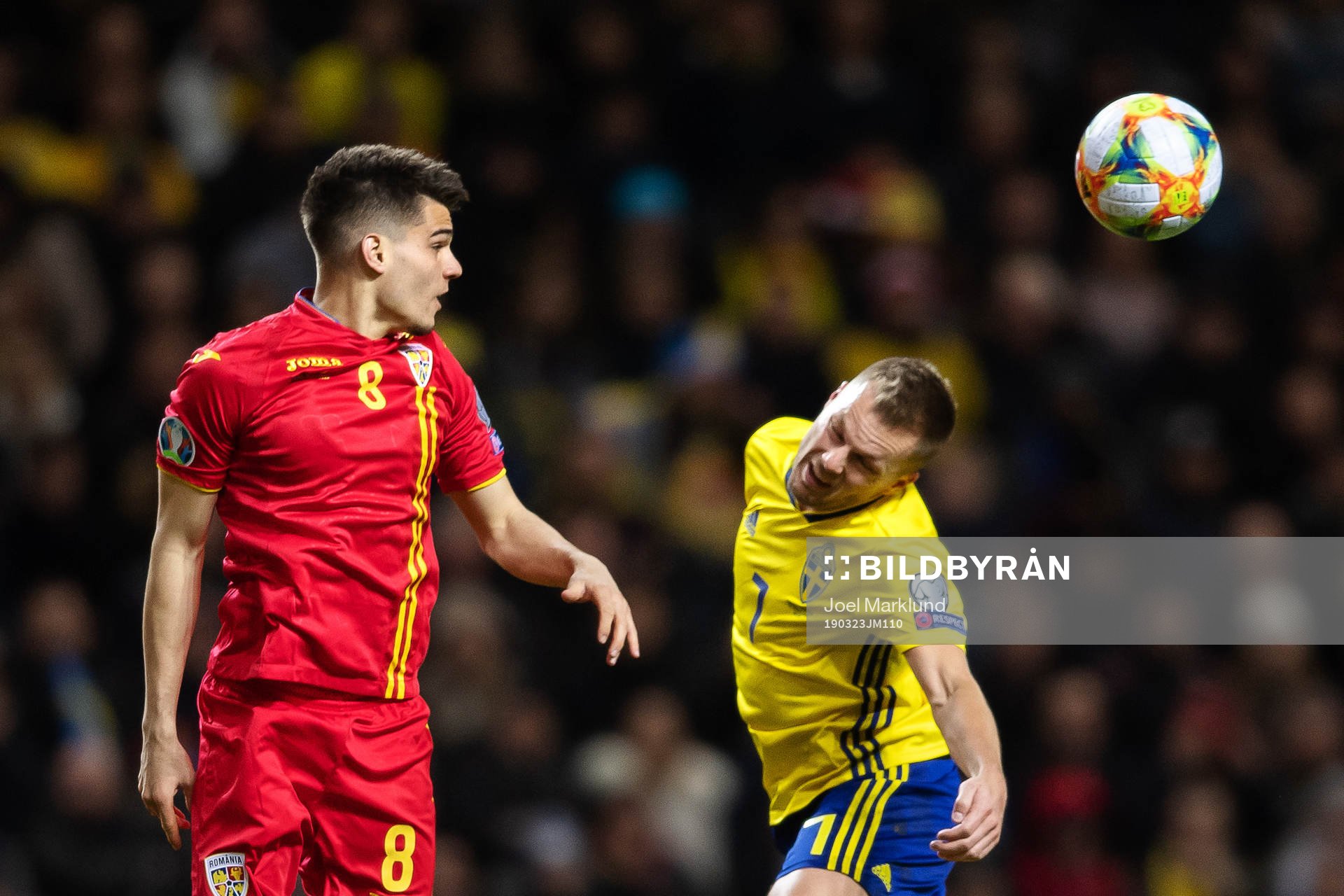 Ianis Hagi of Romania and Sebastian Larsson of Sweden