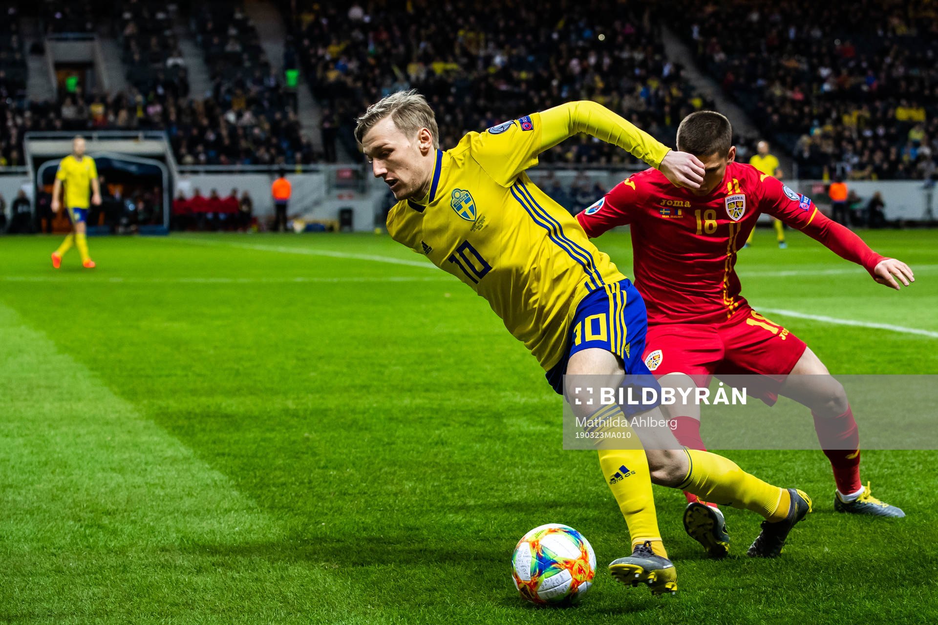 Emil Forsberg of Sweden and Razvan Marin of Romania