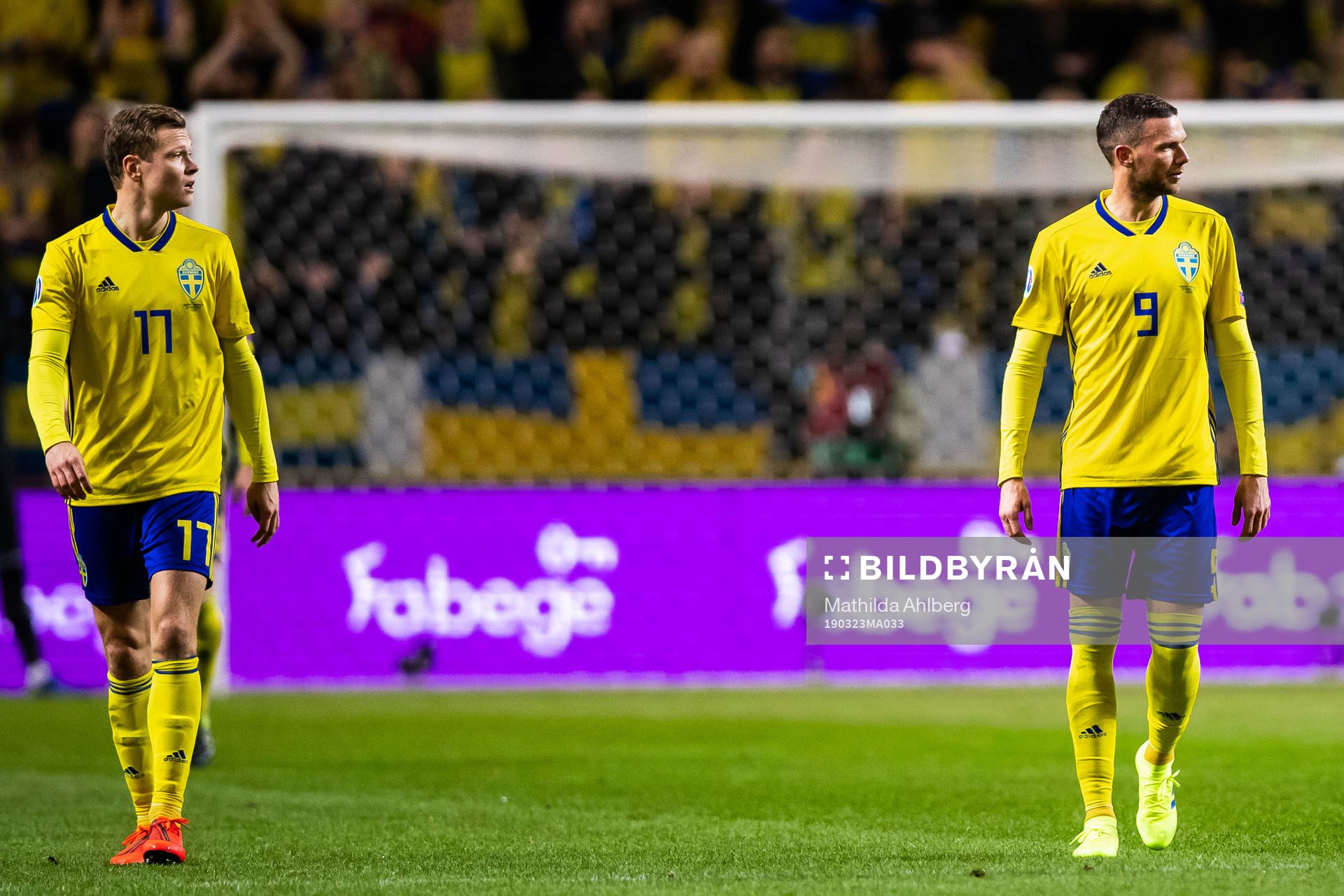 Viktor Claesson  and Marcus Berg of Sweden look dejected