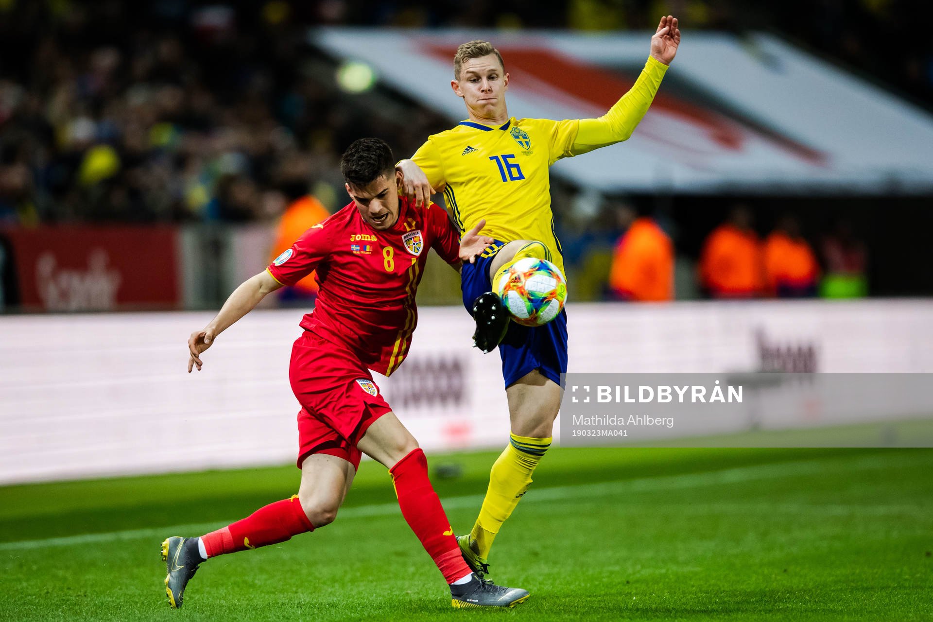 Ianis Hagi of Romania and Emil Krafth of Sweden