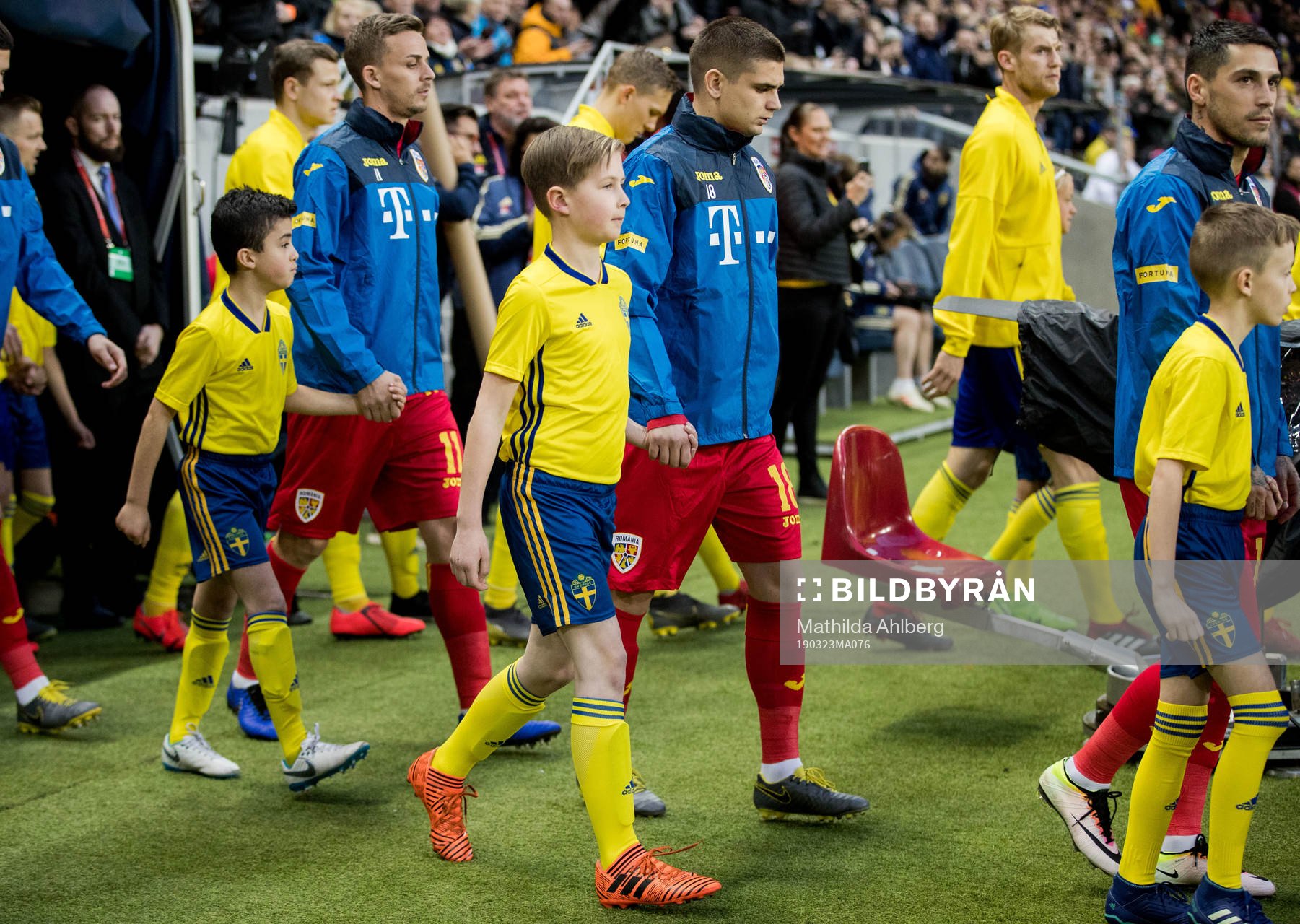 Razvan Marin of Romania with mascots