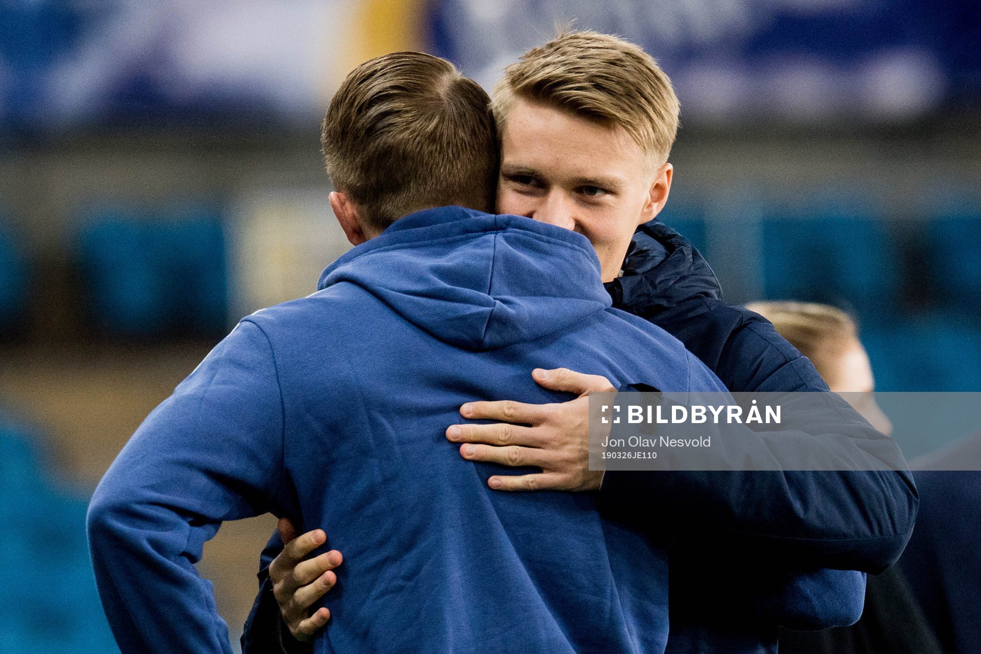 Martin Ødegaard of Norway and Sam Larsson of Sweden hug
