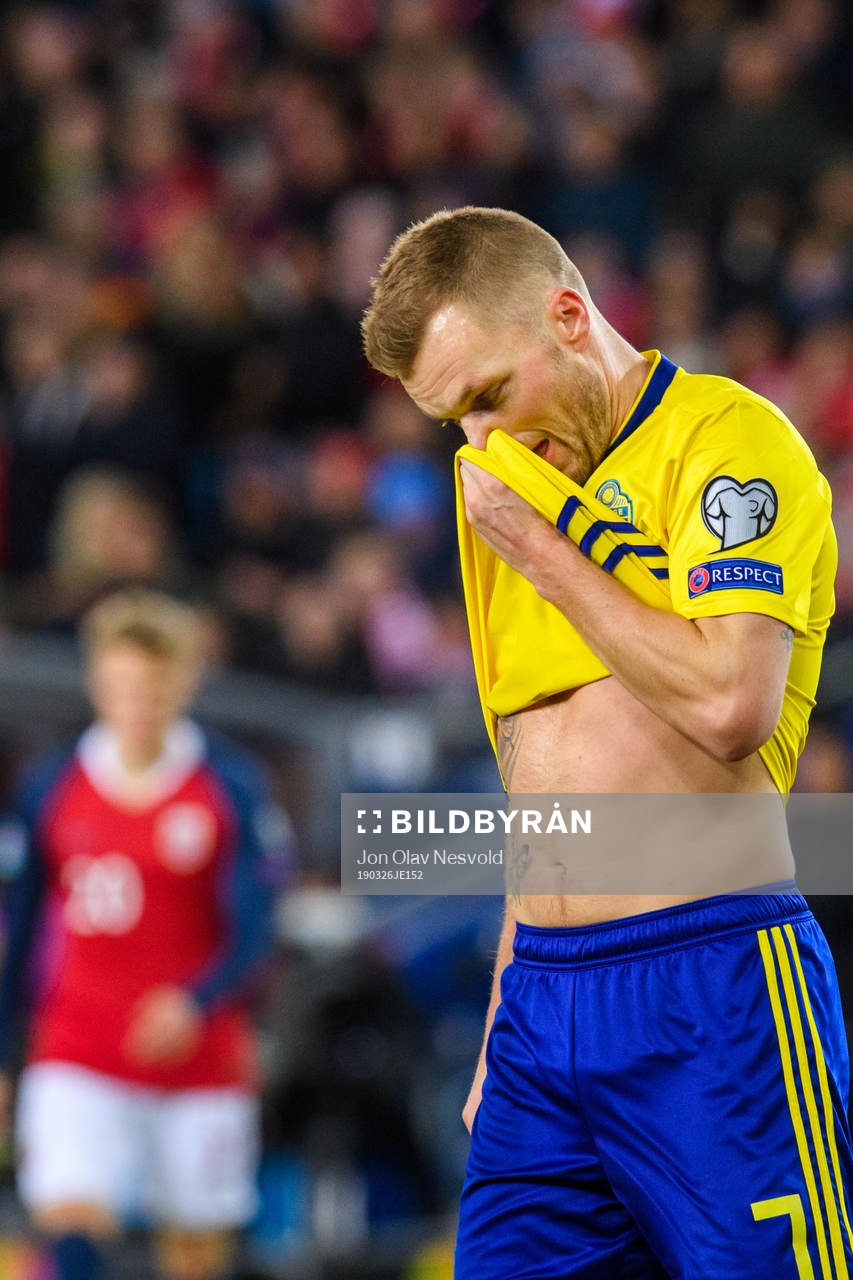 Sebastian Larsson of Sweden looks dejected