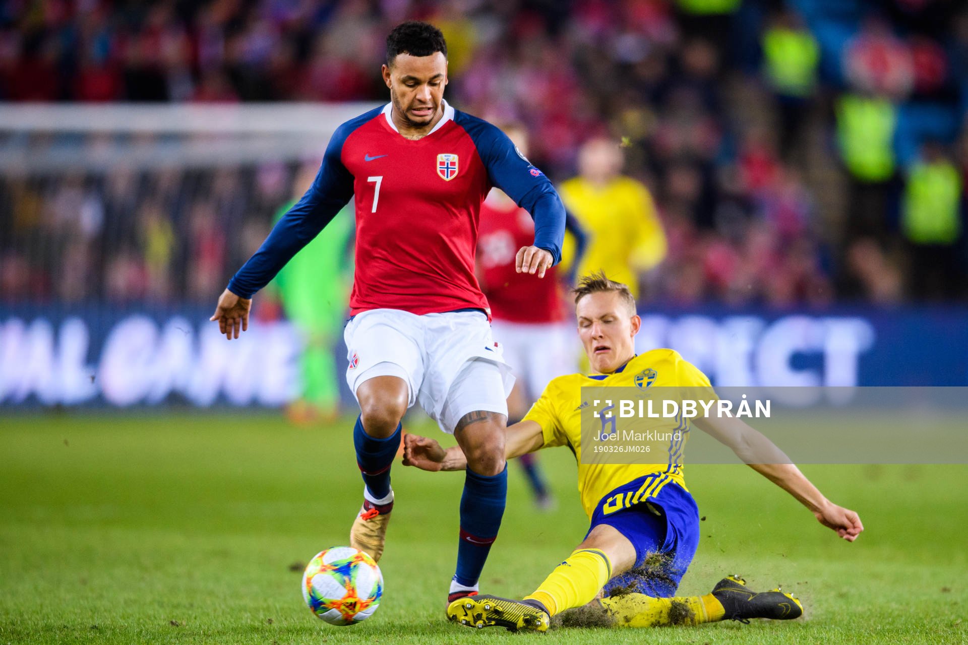 Joshua King of Norway in action with Ludwig Augustinsson of