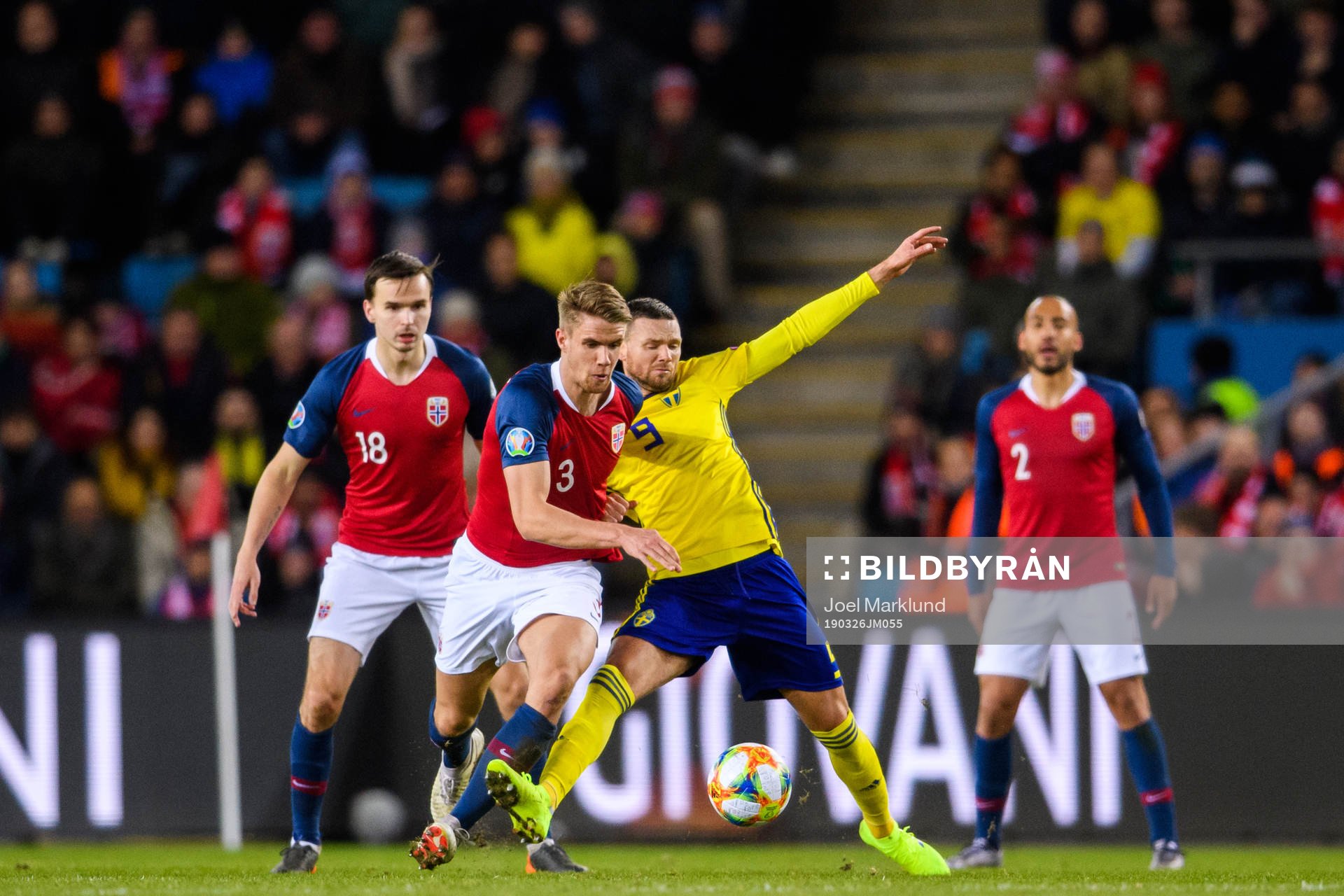 Kristoffer Ajer of Norway in action with Marcus Berg of