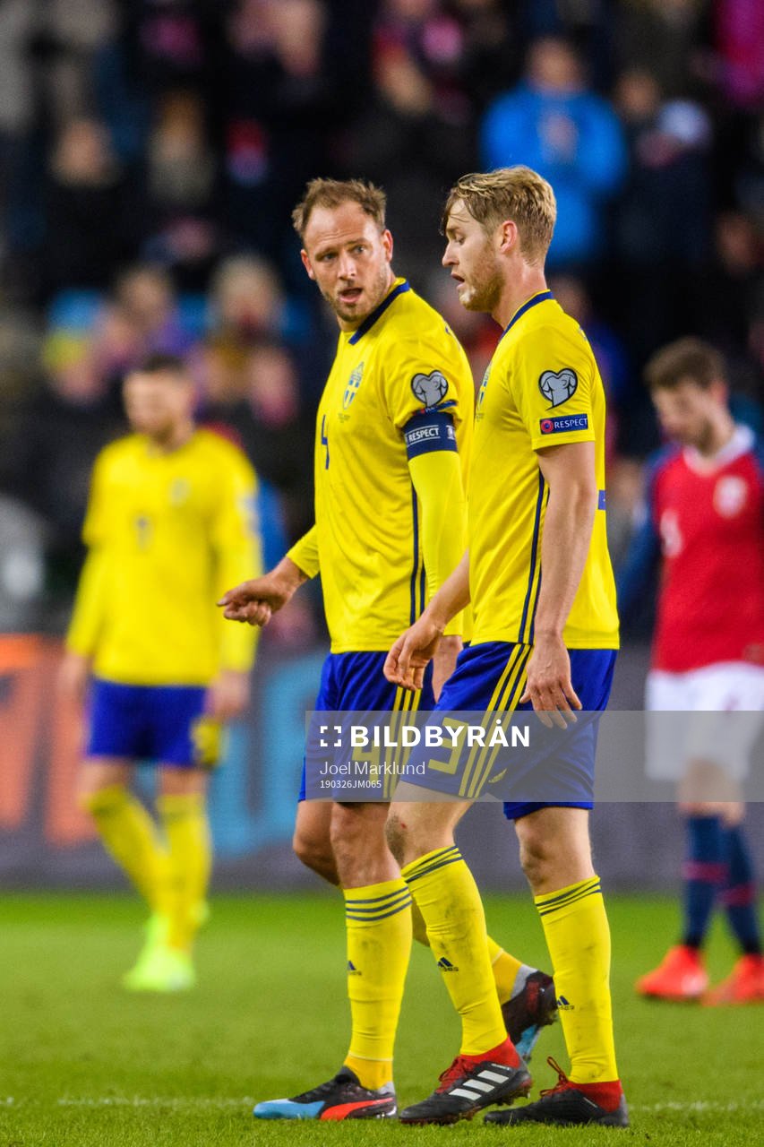 Andreas Granqvist and Filip Helander of Sweden looks