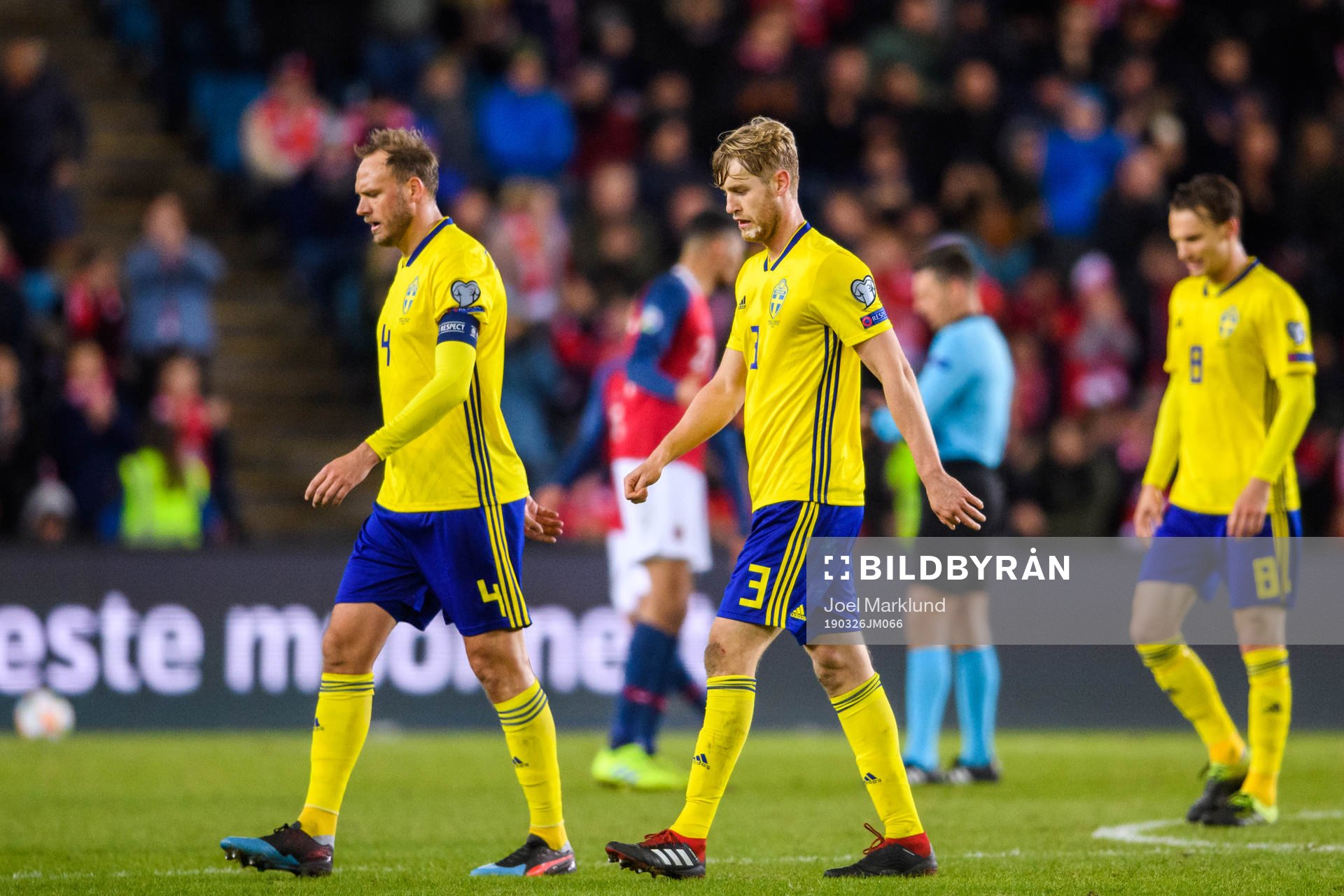 Andreas Granqvist and Filip Helander of Sweden looks