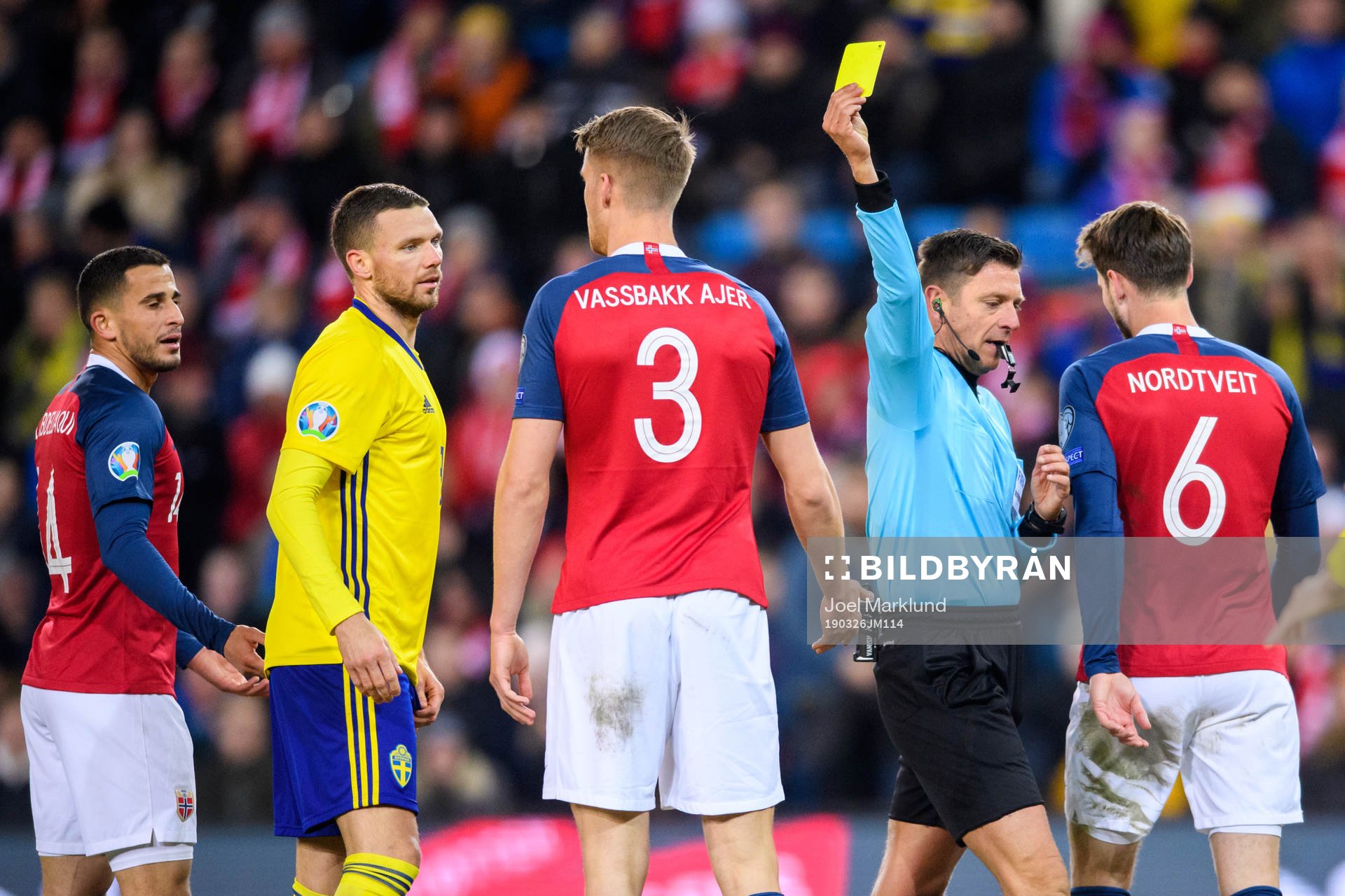 Kristoffer Ajer of Norway is shown a yellow card by Referee