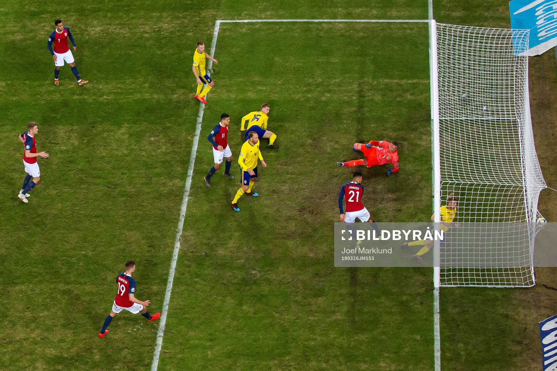 Bjørn Maars Johnsen of Norway scores 1-0 behind goalkeeper