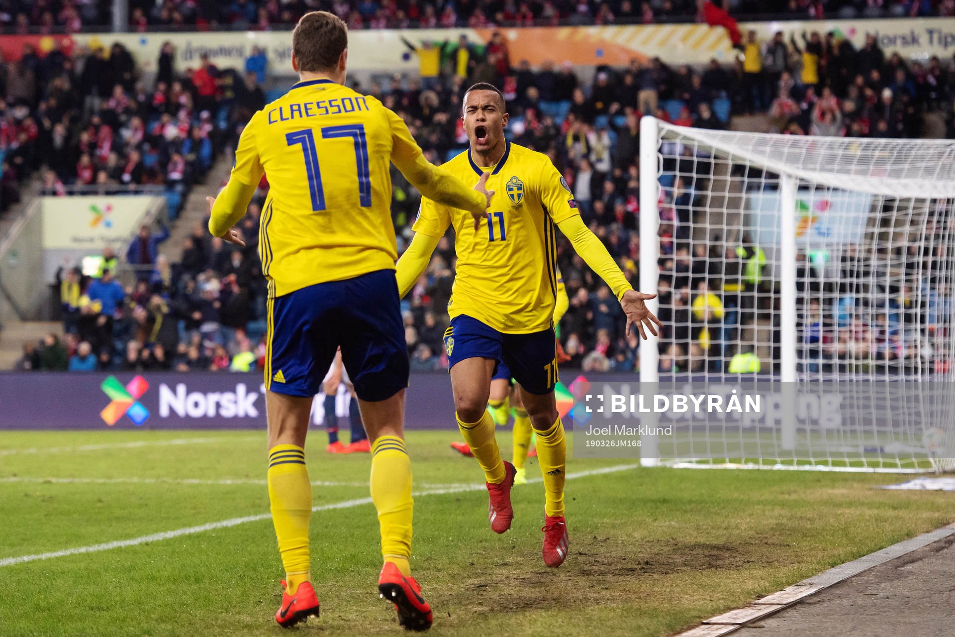 Viktor Claesson and Robin Quaison of Sweden celebrate