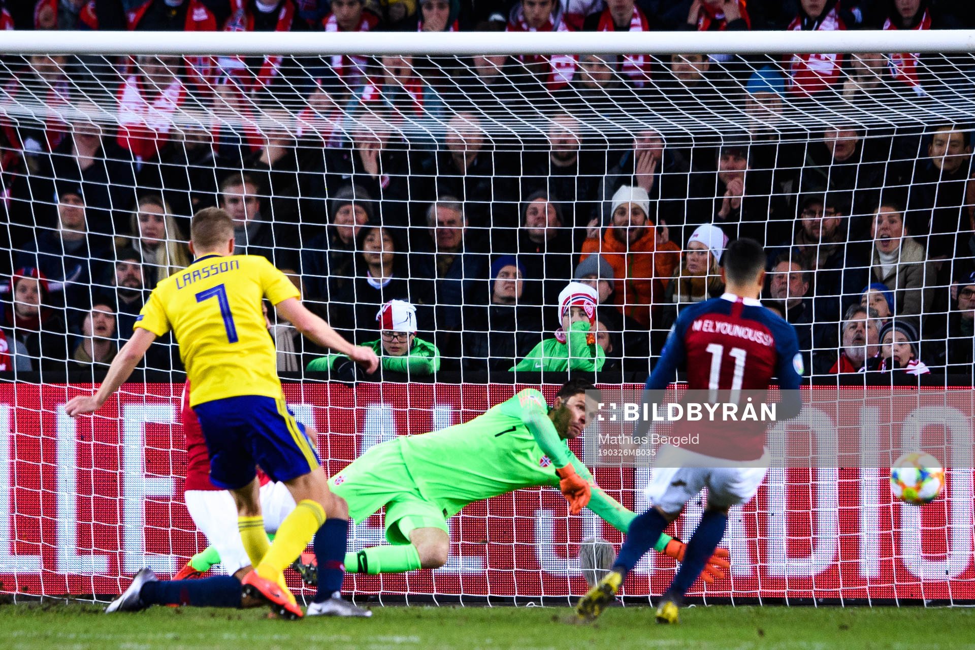Sebastian Larsson of Sweden against goalkeeper Rune