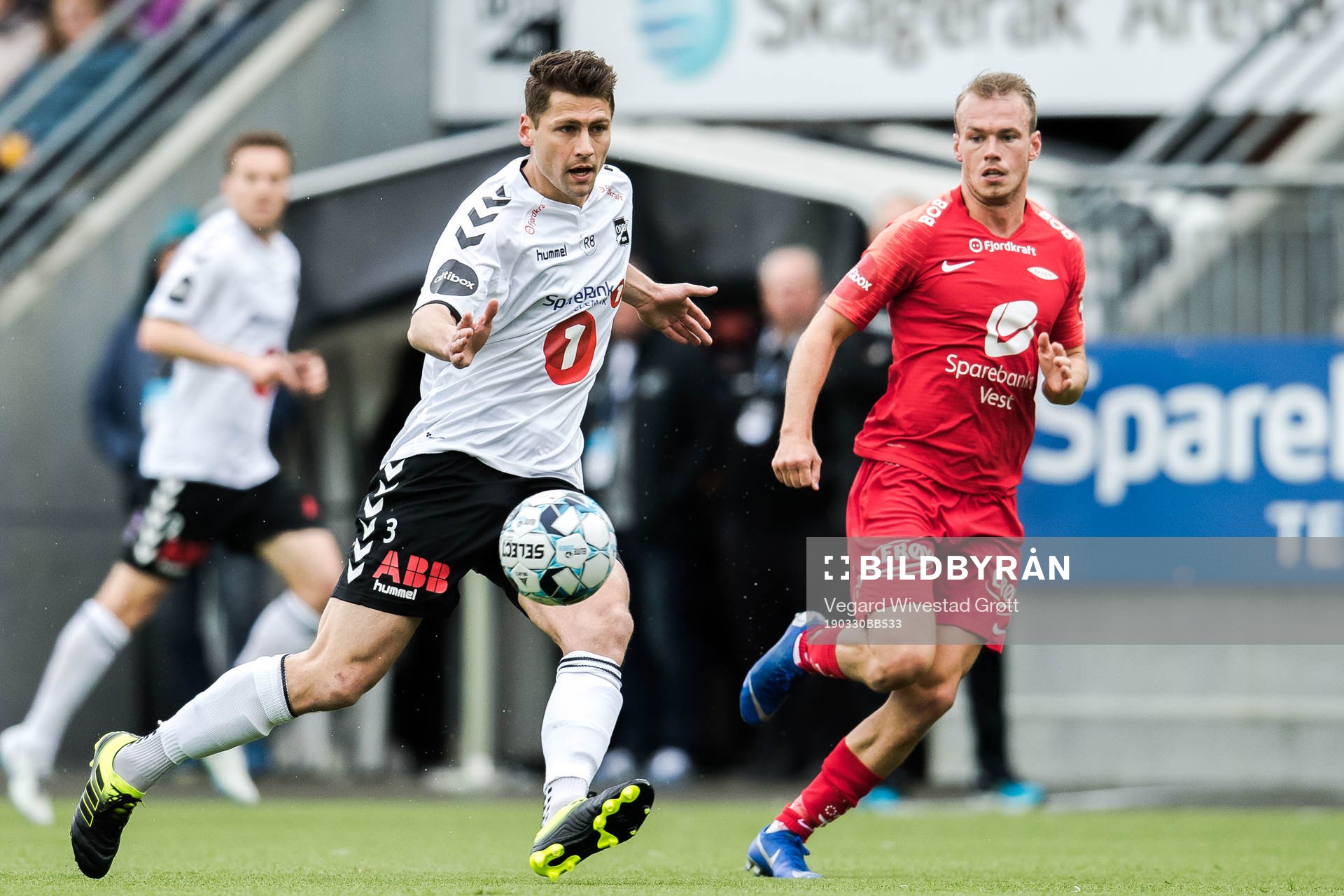 Fredrik Semb Berge of Odd and Petter Dahle Strand of Brann during the Eliteserien football match between Odd and Brann on March 30, 2019 in Skien.