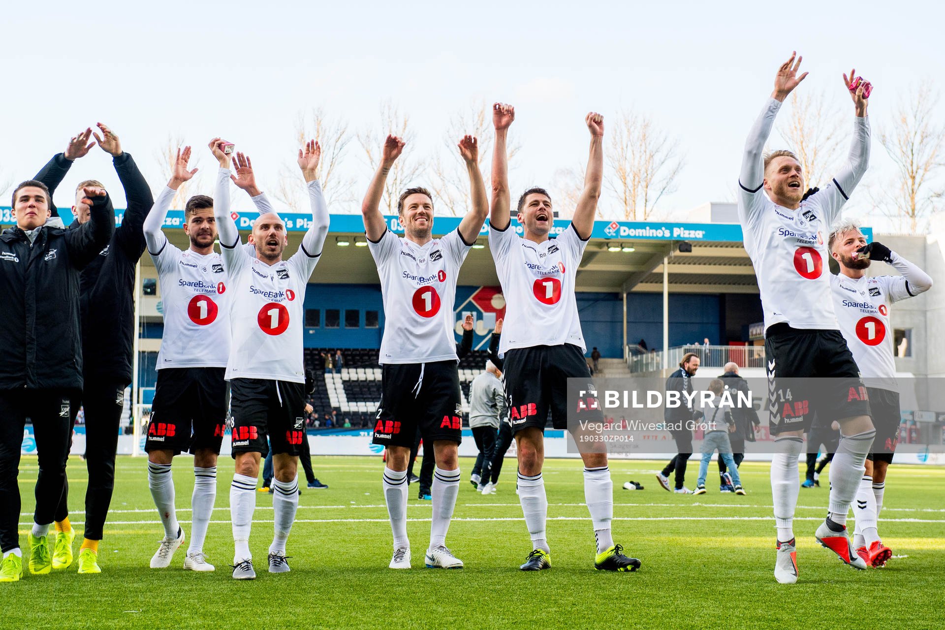 Fredrik Oldrup Jensen, Jone Samuelsen, Espen Ruud, Fredrik Lund Nordkvelle and Sander Svendsen of Odd celebrate after winning the Eliteserien football match between Odd and Brann on March 30, 2019 in Skien.