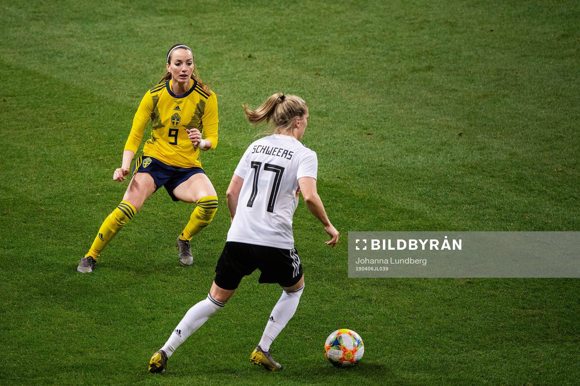 Kosovare Asllani of Sweden and Verena Schweers of Germany