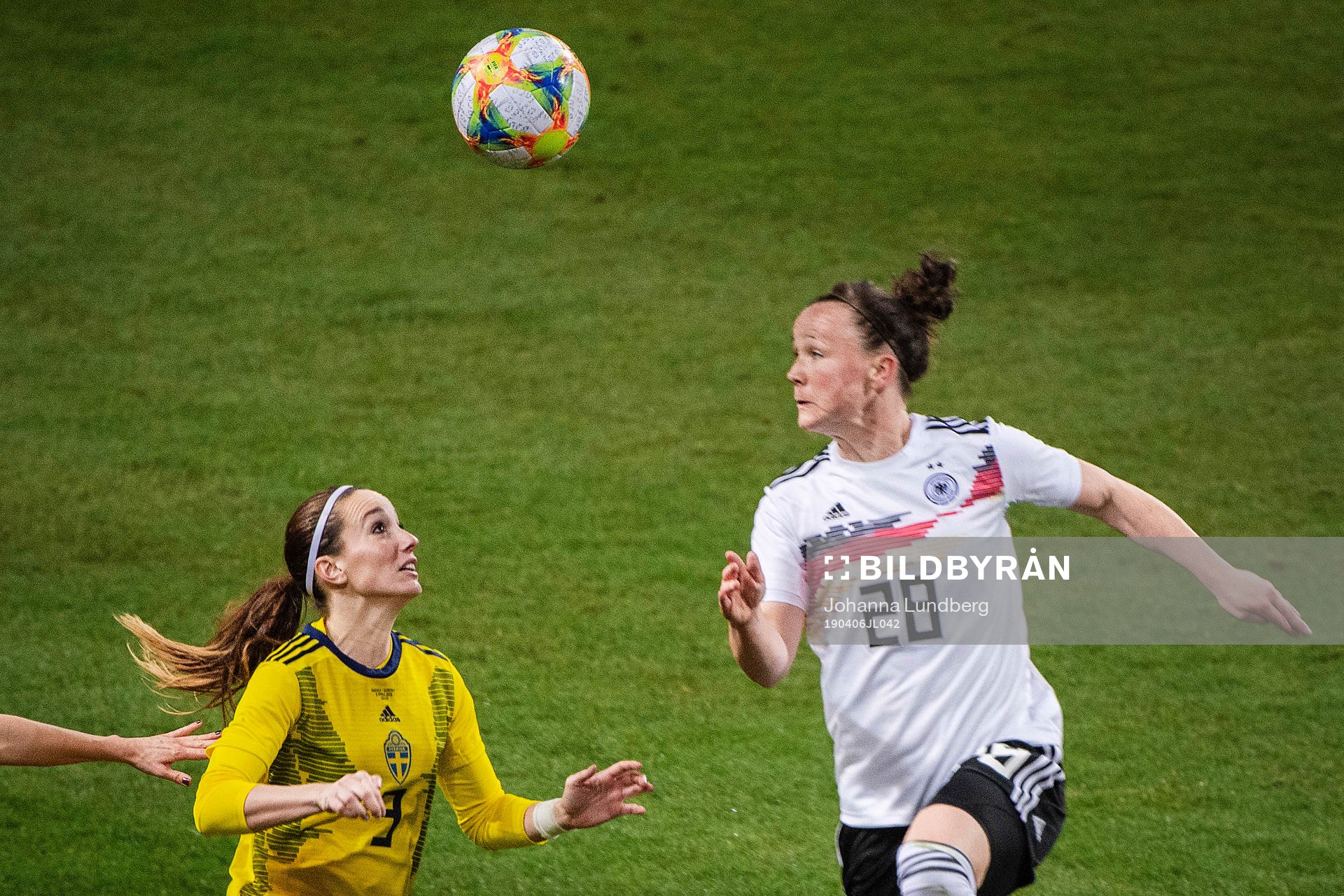 Kosovare Asllani of Sweden and Marina Hegering of Germany