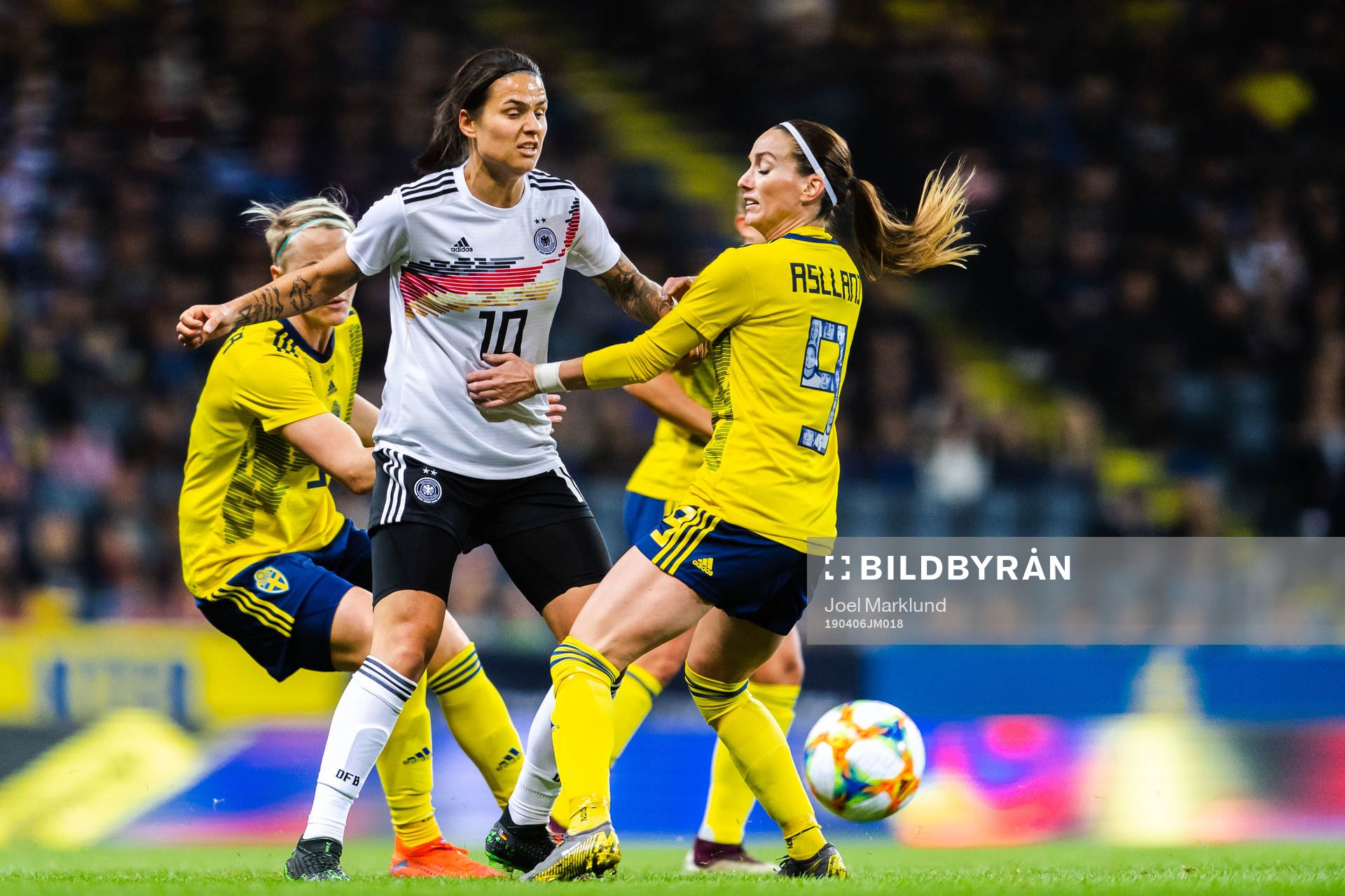 Dzsenifer Marozsan of Germany and Kosovare Asllani of Sweden