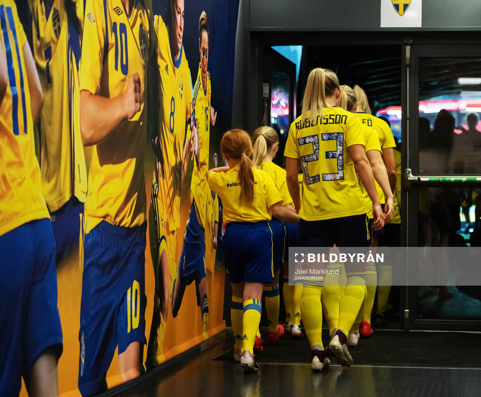 Elin Rubensson of Sweden enter the field in hand with a