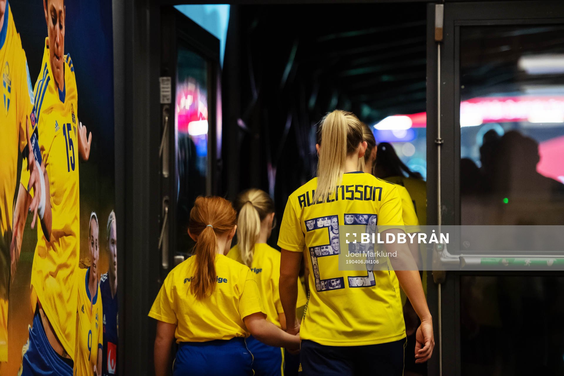 Elin Rubensson of Sweden enter the field in hand with a