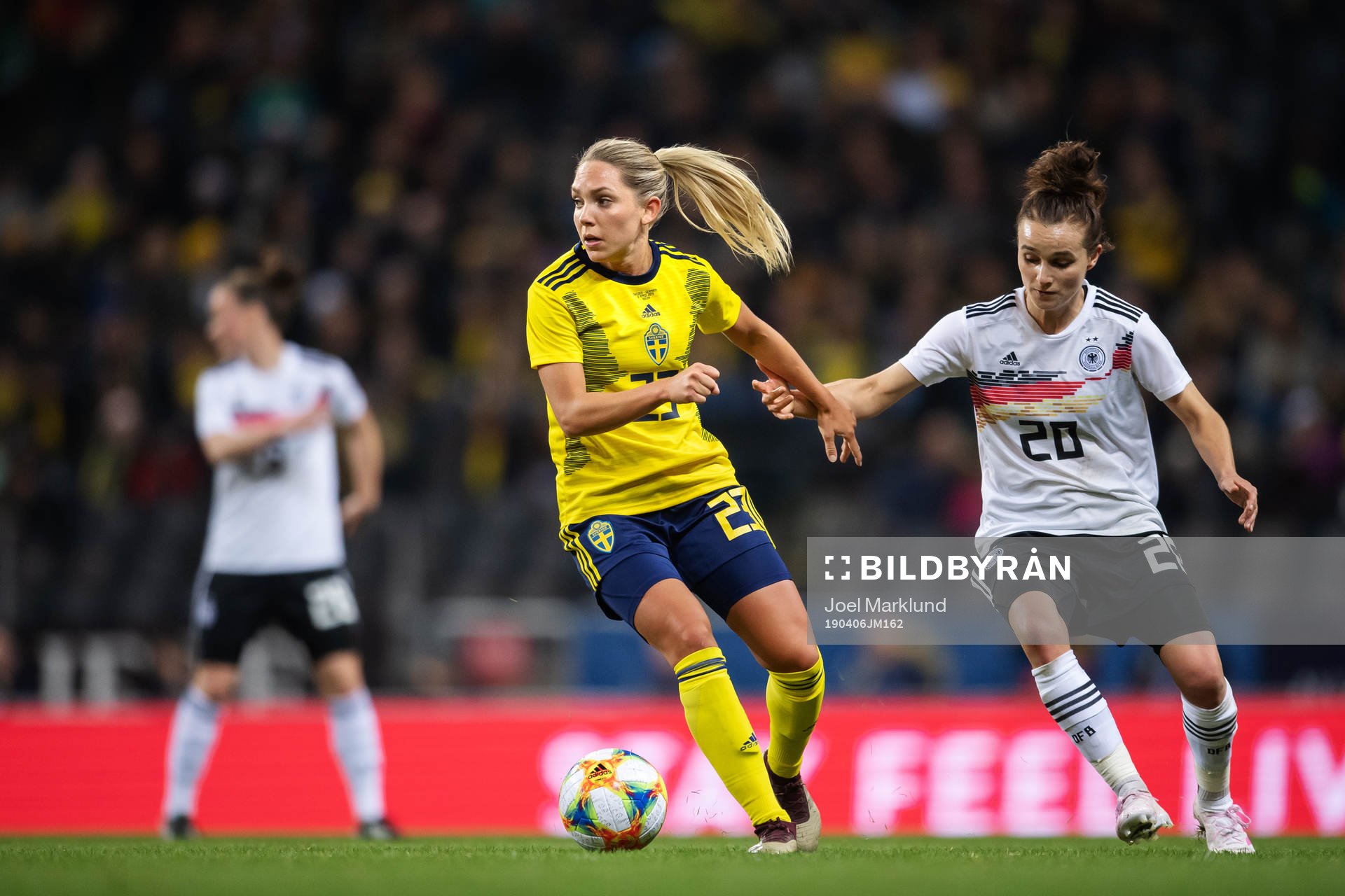 Elin Rubensson of Sweden and Lina Magull of Germany