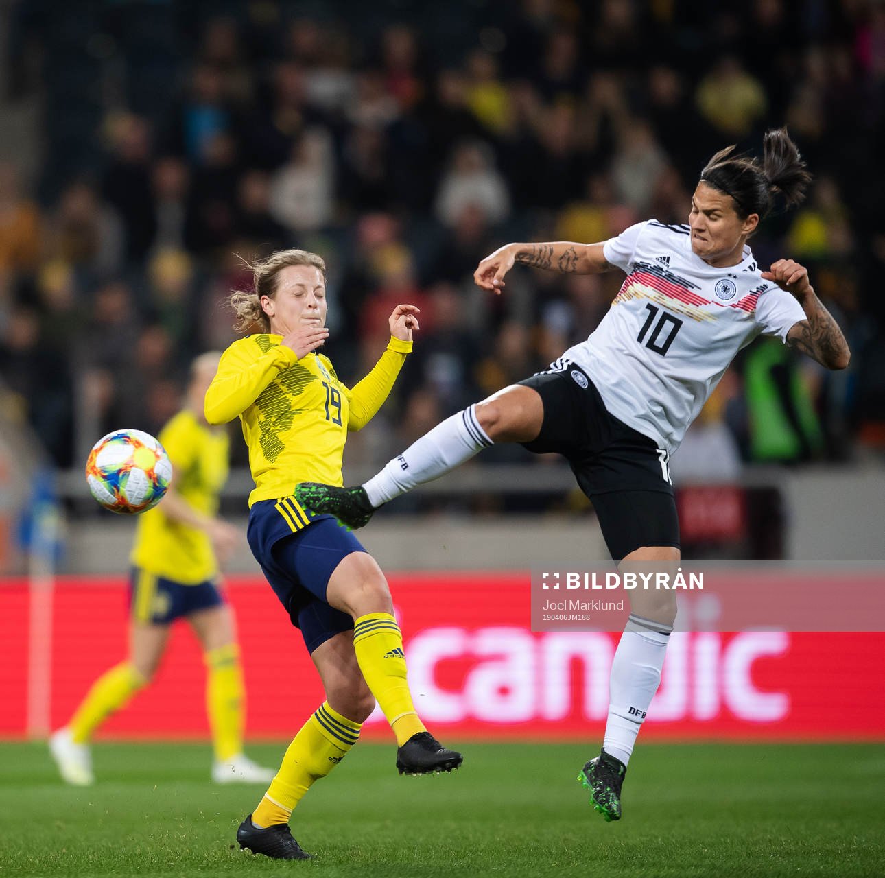 Anna Anvegård of Sweden and Dzsenifer Marozsan of Germany
