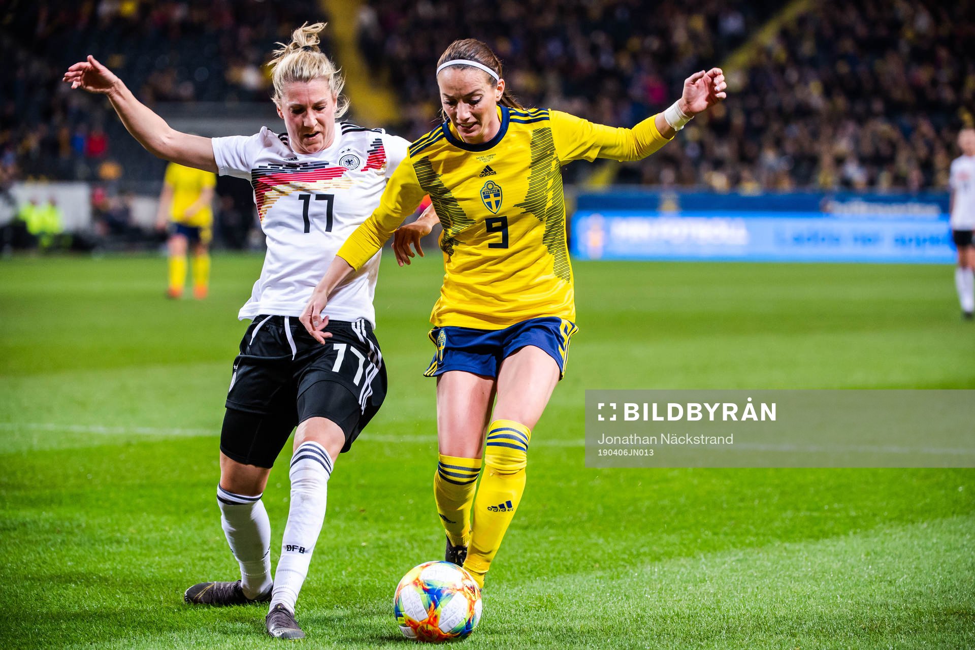 Verena Schweers of Germany and Kosovare Asllani of Sweden