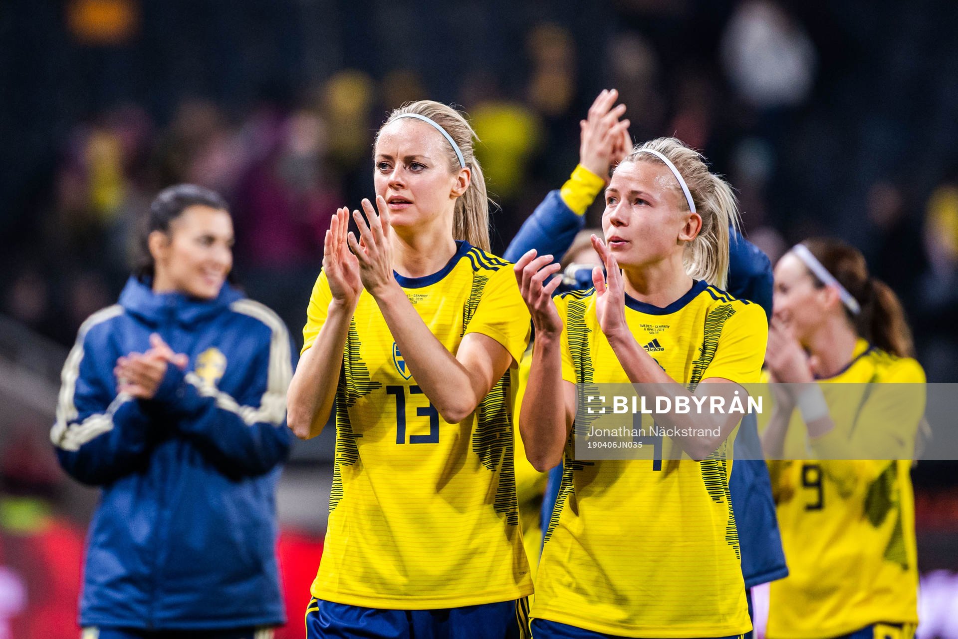 Amanda Ilestedt and Kosovare Asllani thank the supporters after the women's international friendly football match between Sweden and Germany on April 6, 2019 in Stockholm.