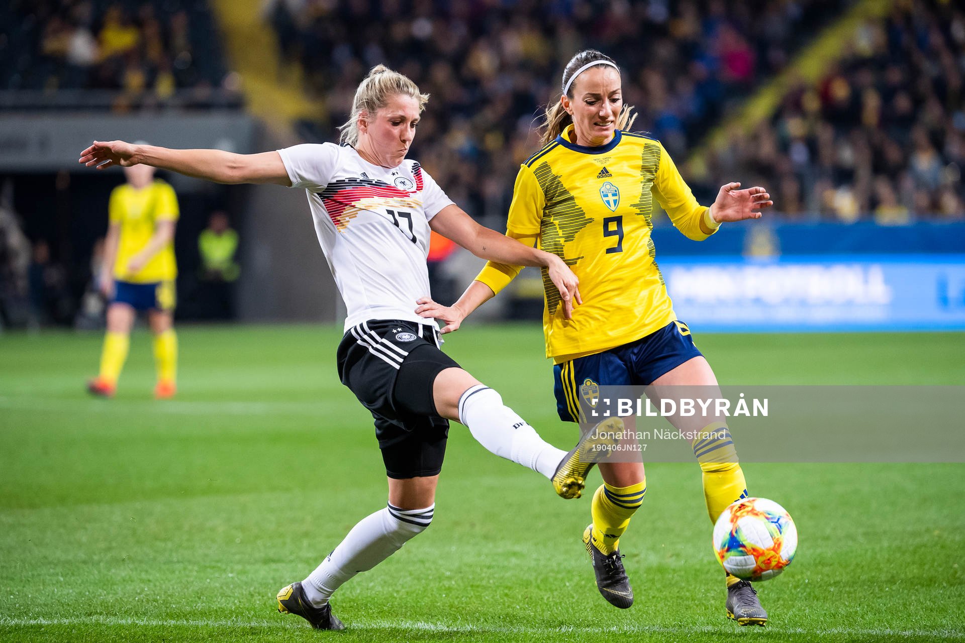 Kosovare Asllani of Sweden and Verena Schweers of Germany