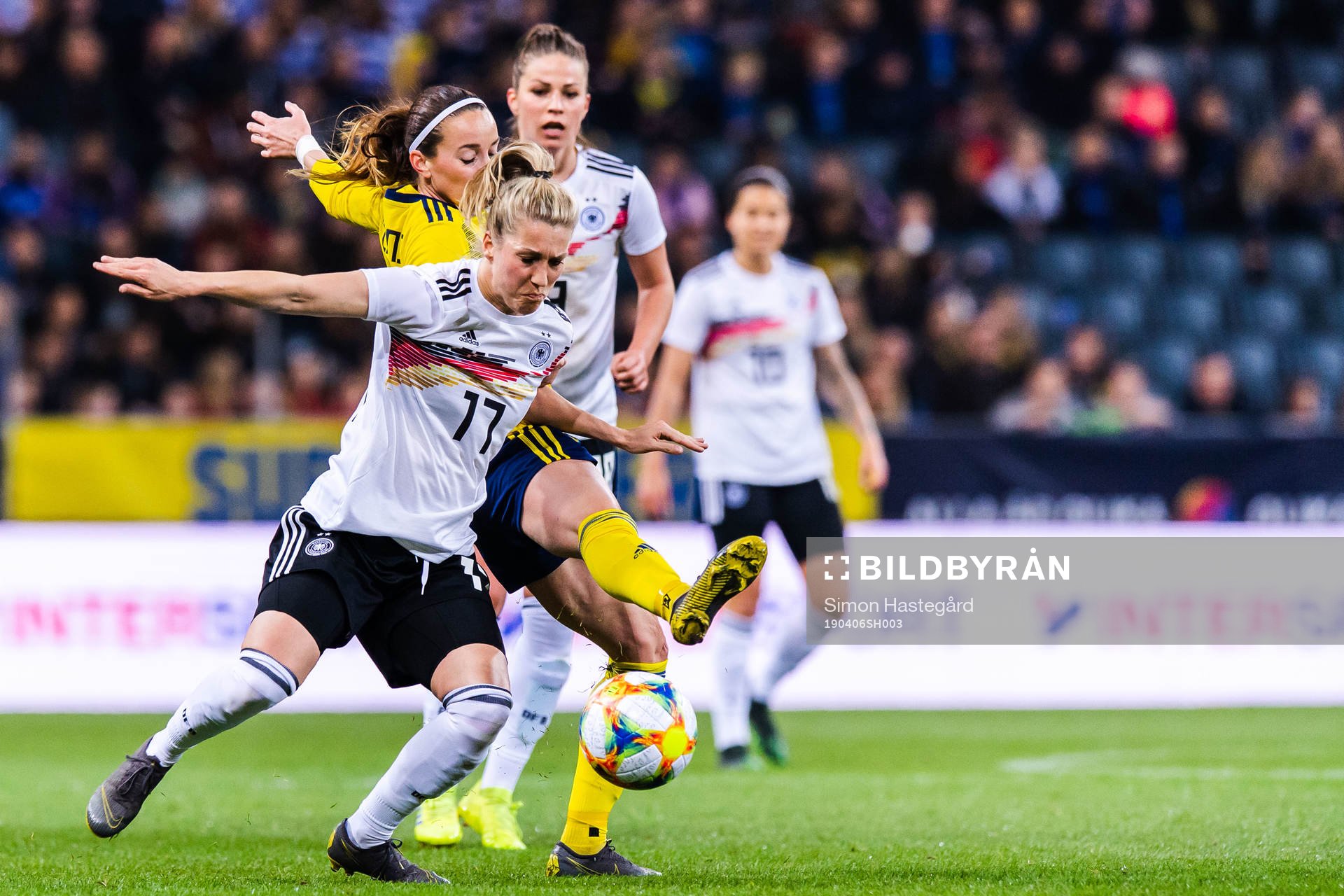 Kosovare Asllani of Sweden and Verena Schweers of Germany