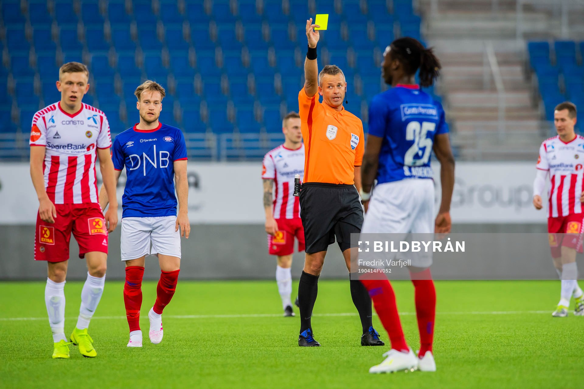 Sam Adekugbe of Vålerenga is shown a yellow card bye Svein