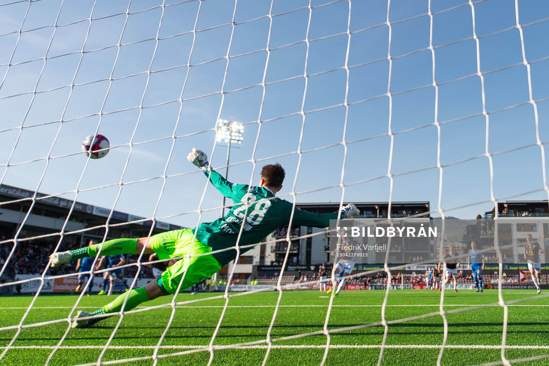 Tonny Brochmann of Mjøndalen scores 1-0 behind goalkeeper