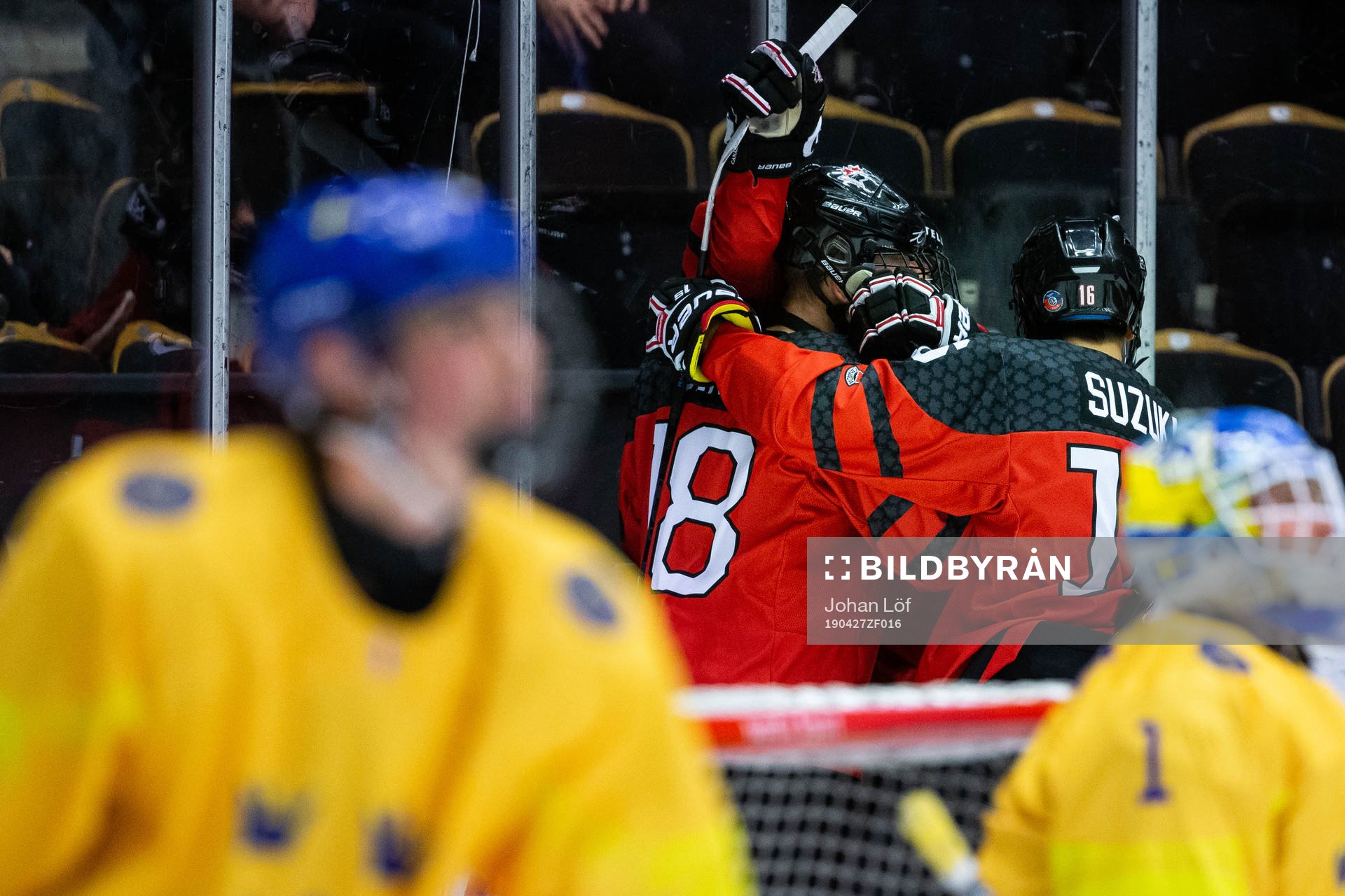 Connor Zary of Canada celebrate with team mates