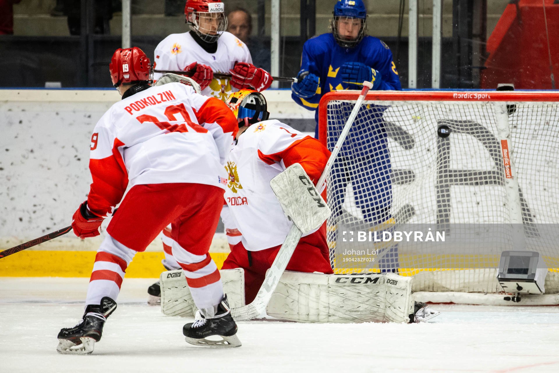 Lucas Raymond of Sweden (not in picrture) scores 4-3 behind