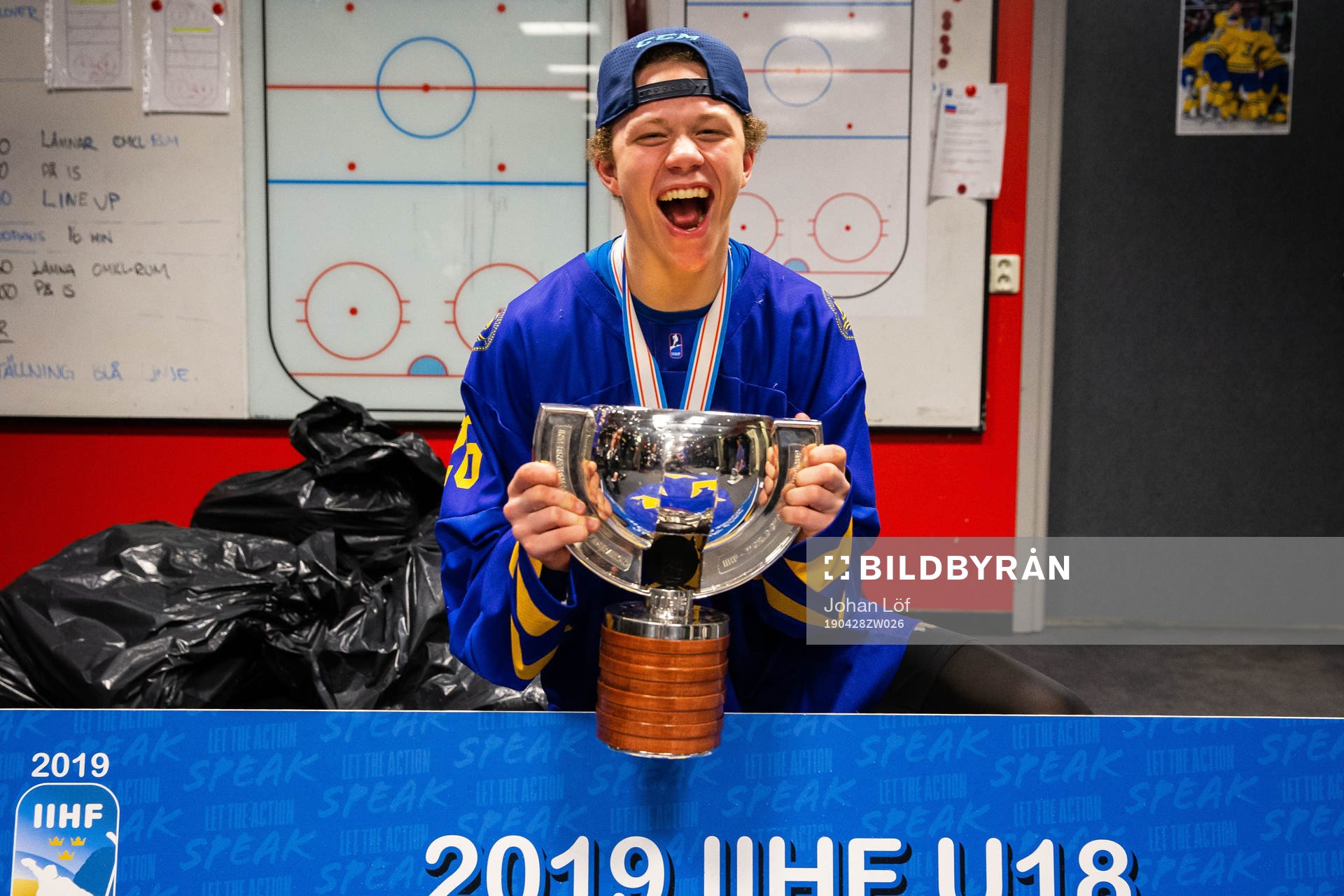 Lucas Raymond of Sweden celebrates with the trophy