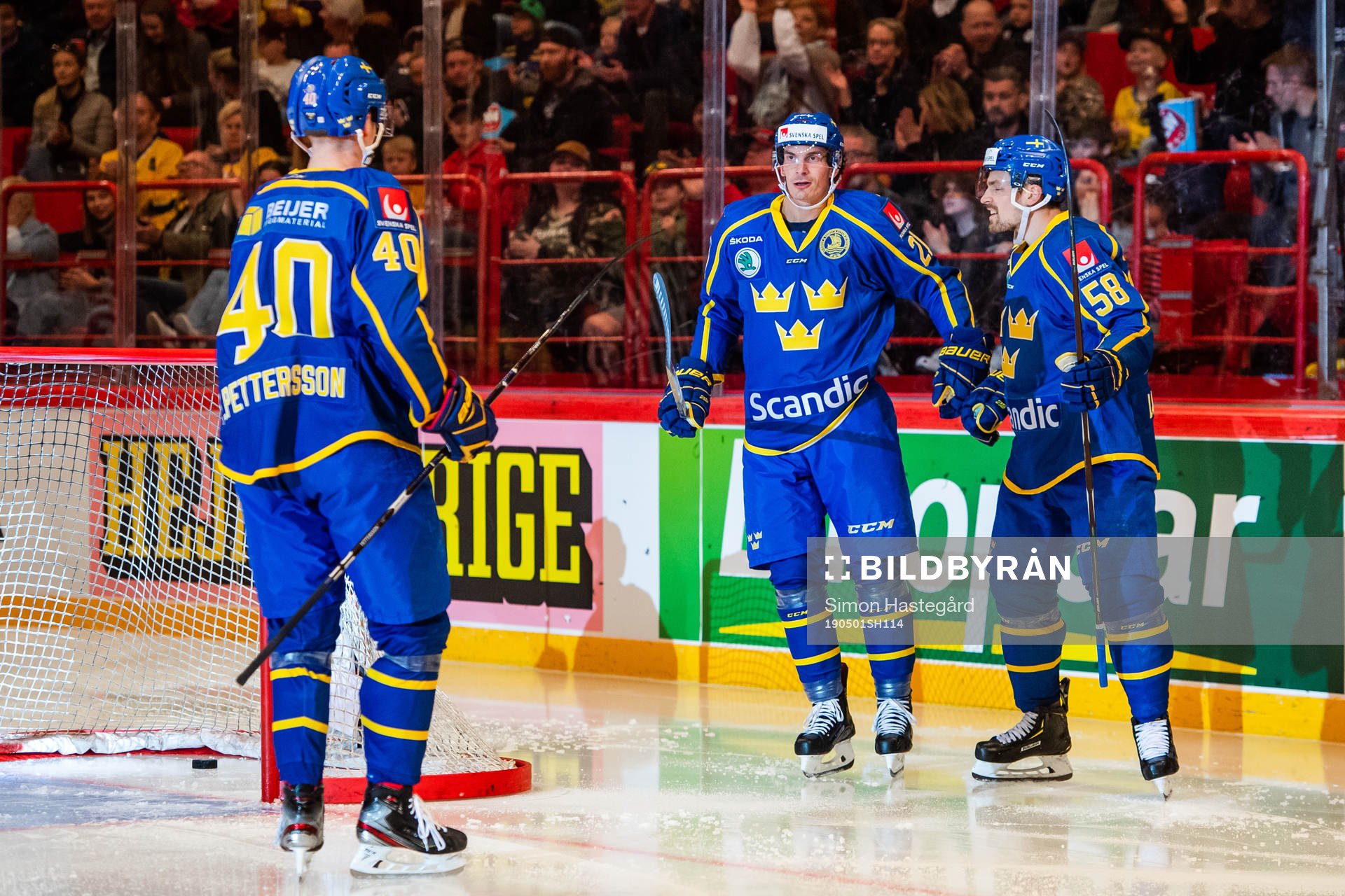 Loui Eriksson celebrate with Elias Pettersson and Anton