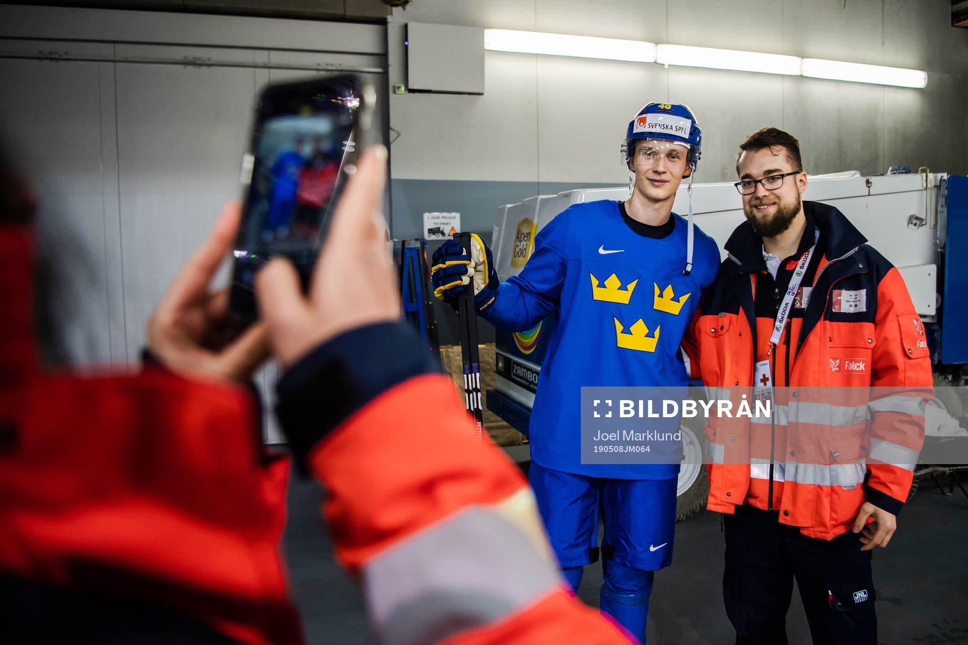 Elias Pettersson of Sweden takes selfies with supporters