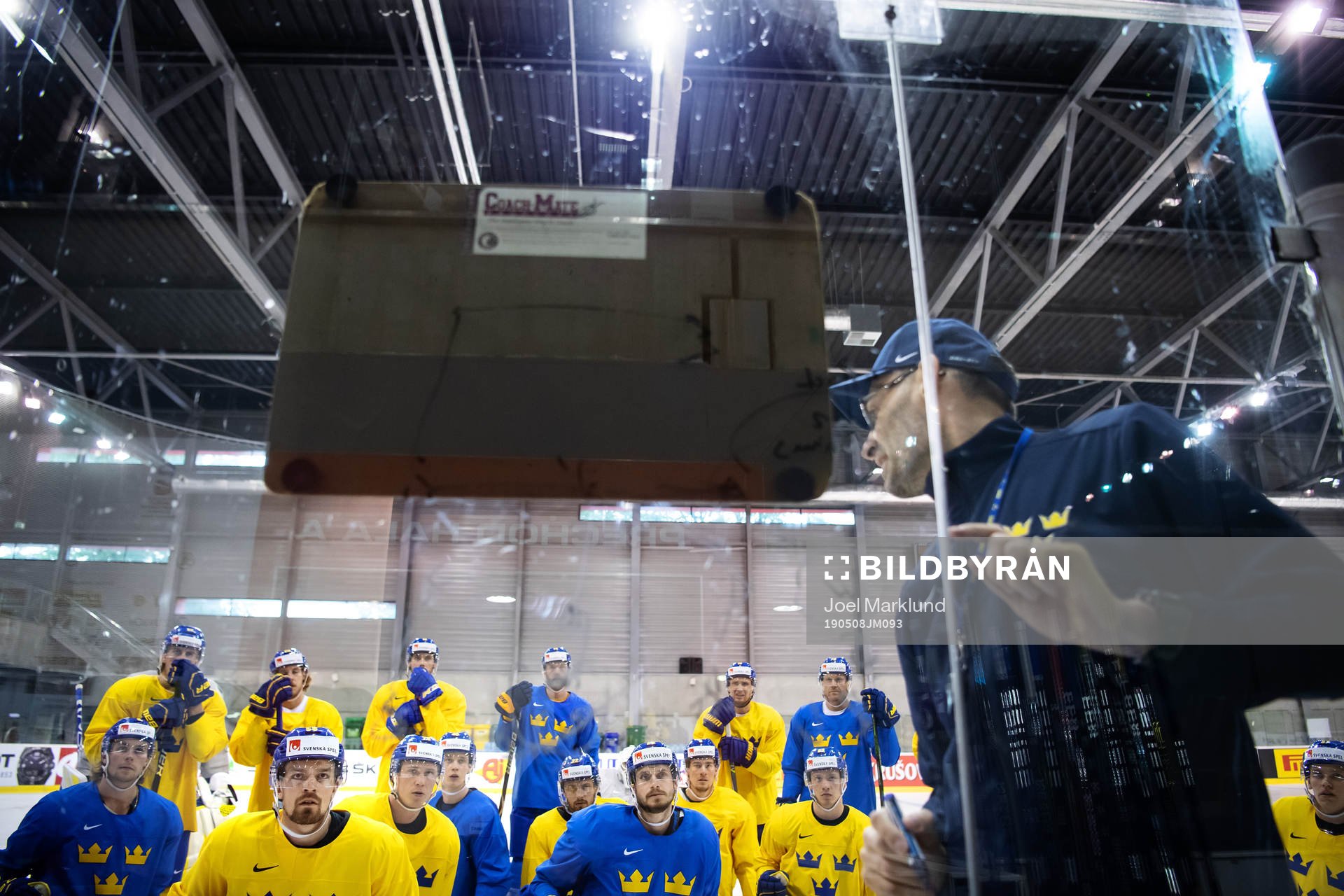Players listen to assistant coach Peter Popovic of Sweden