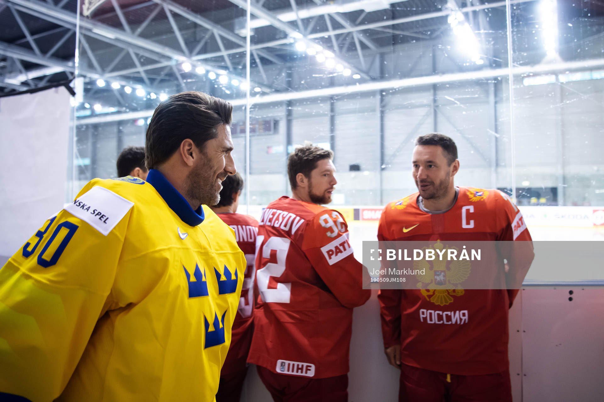 Goaltender Henrik Lundqvist of Sweden greets Ilya Kovalchuk