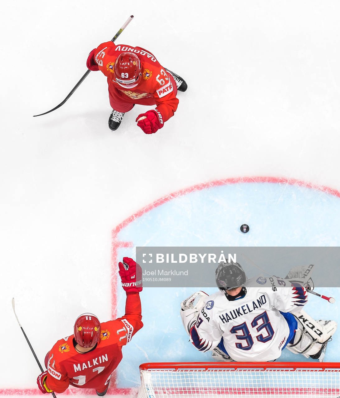 Yevgeni Dadonov and Evgeni Malkin of Russia celebrate the