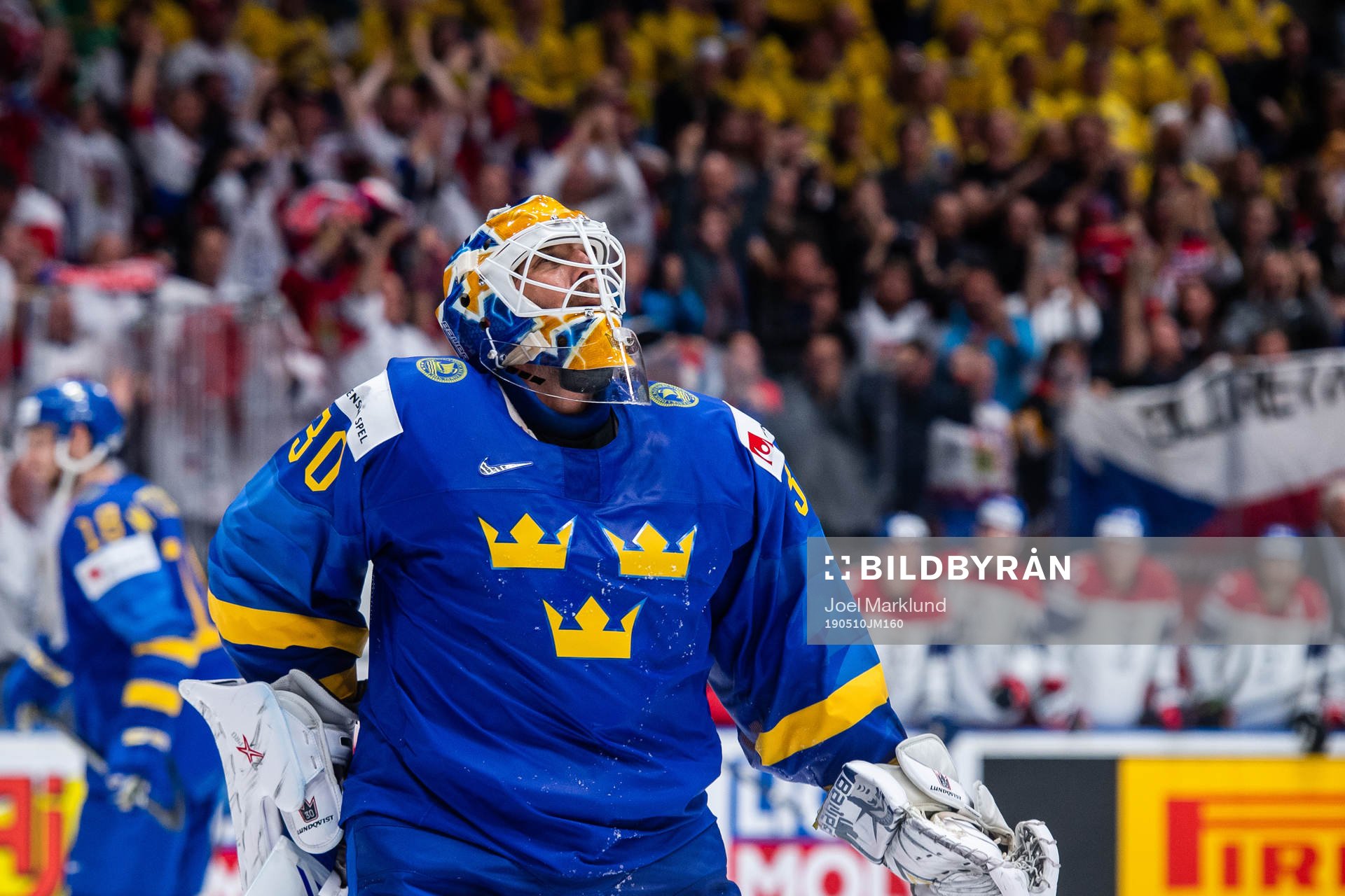 Goaltender Henrik Lundqvist of Sweden looks dejected
