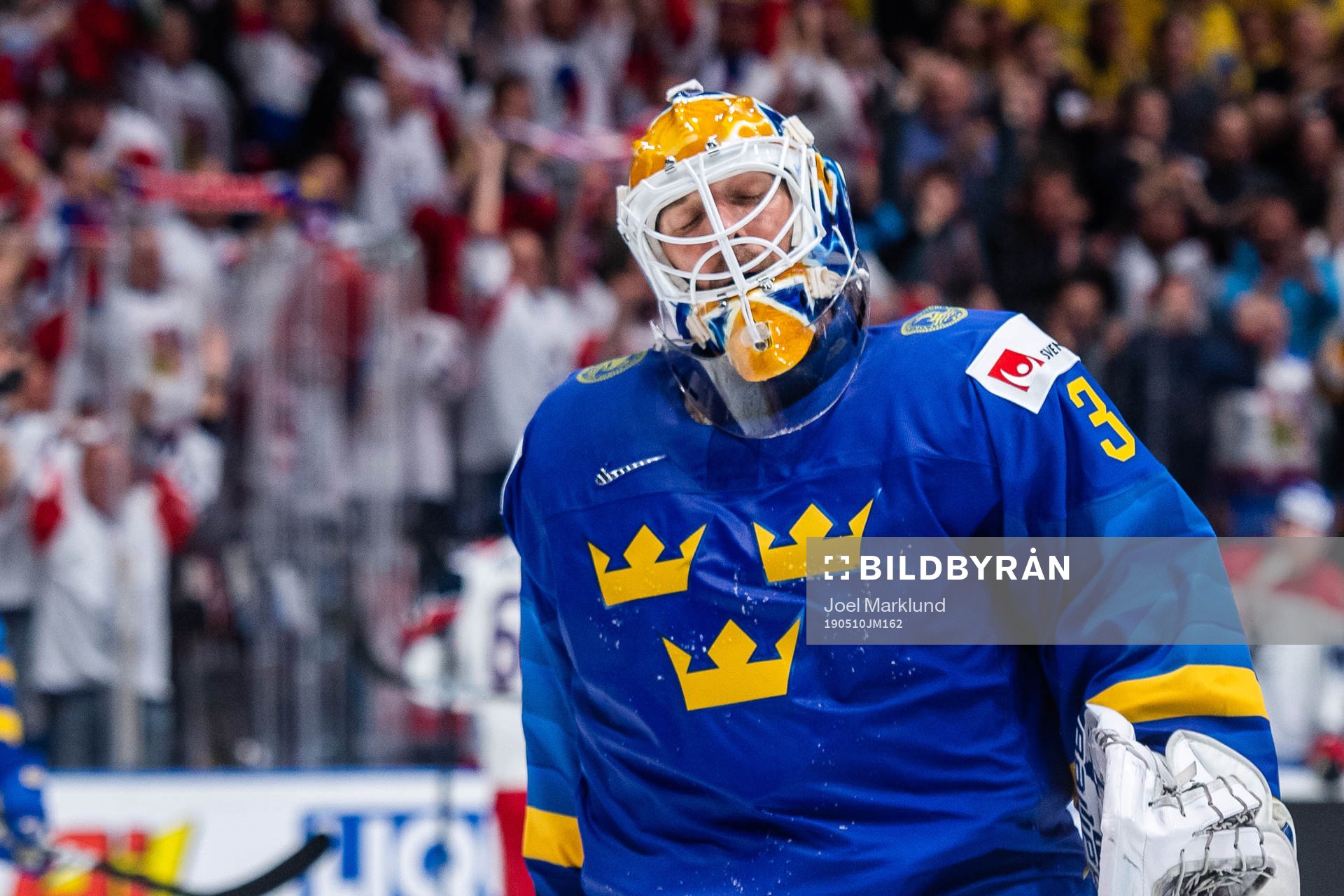 Goaltender Henrik Lundqvist of Sweden looks dejected
