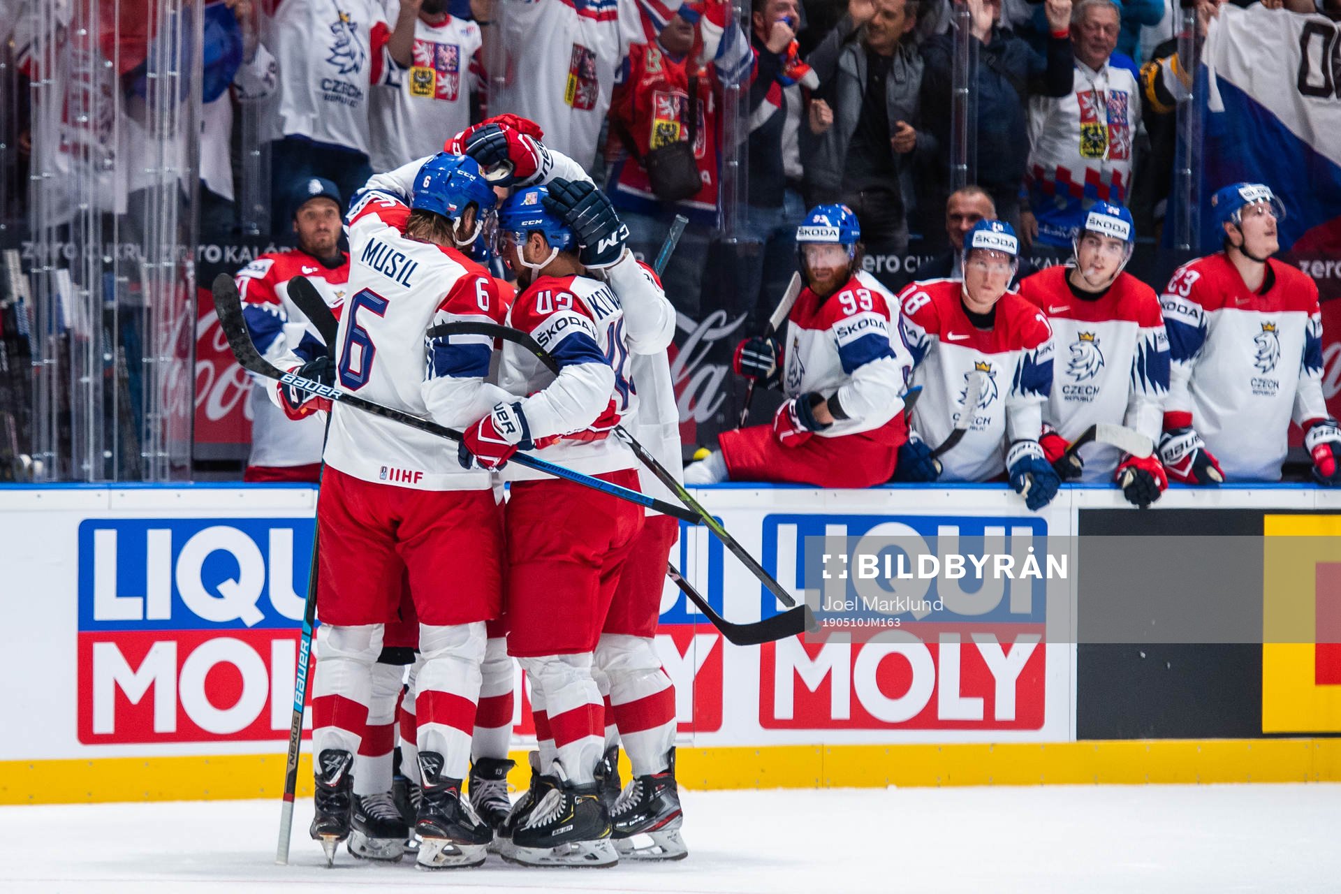 David Musil and Jan Kovar celebrate with Dominik Kubalik of