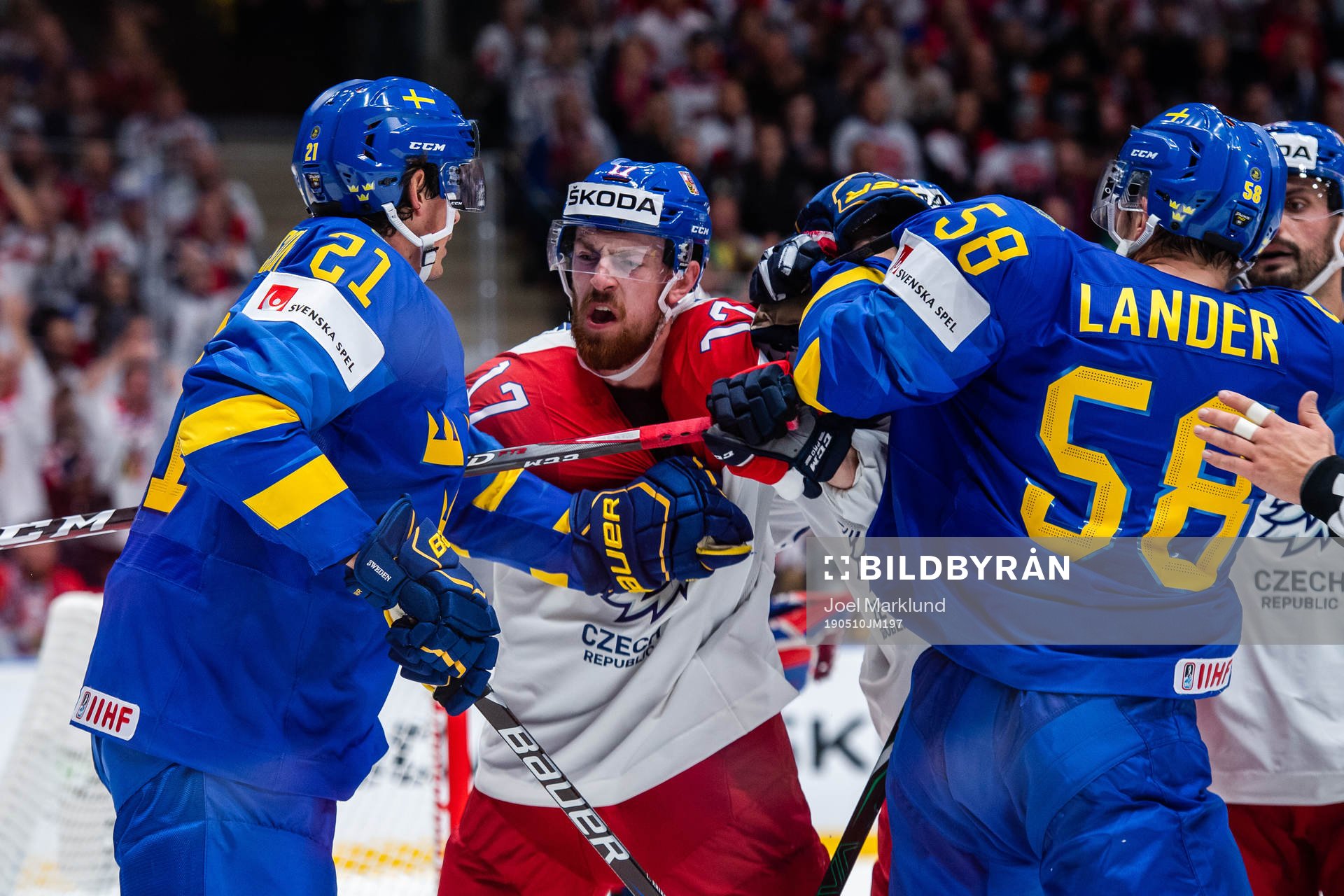 Loui Eriksson and Anton Lander  of Sweden fights Michal