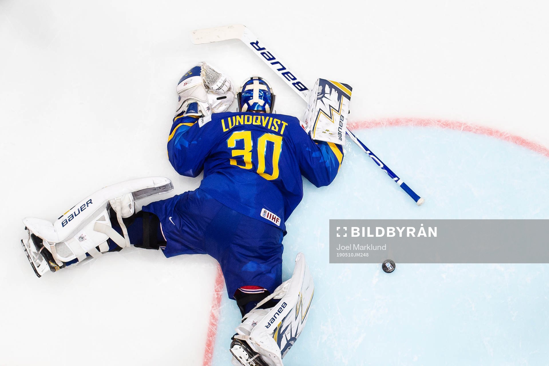 Goaltender Henrik Lundqvist of Sweden looks dejected