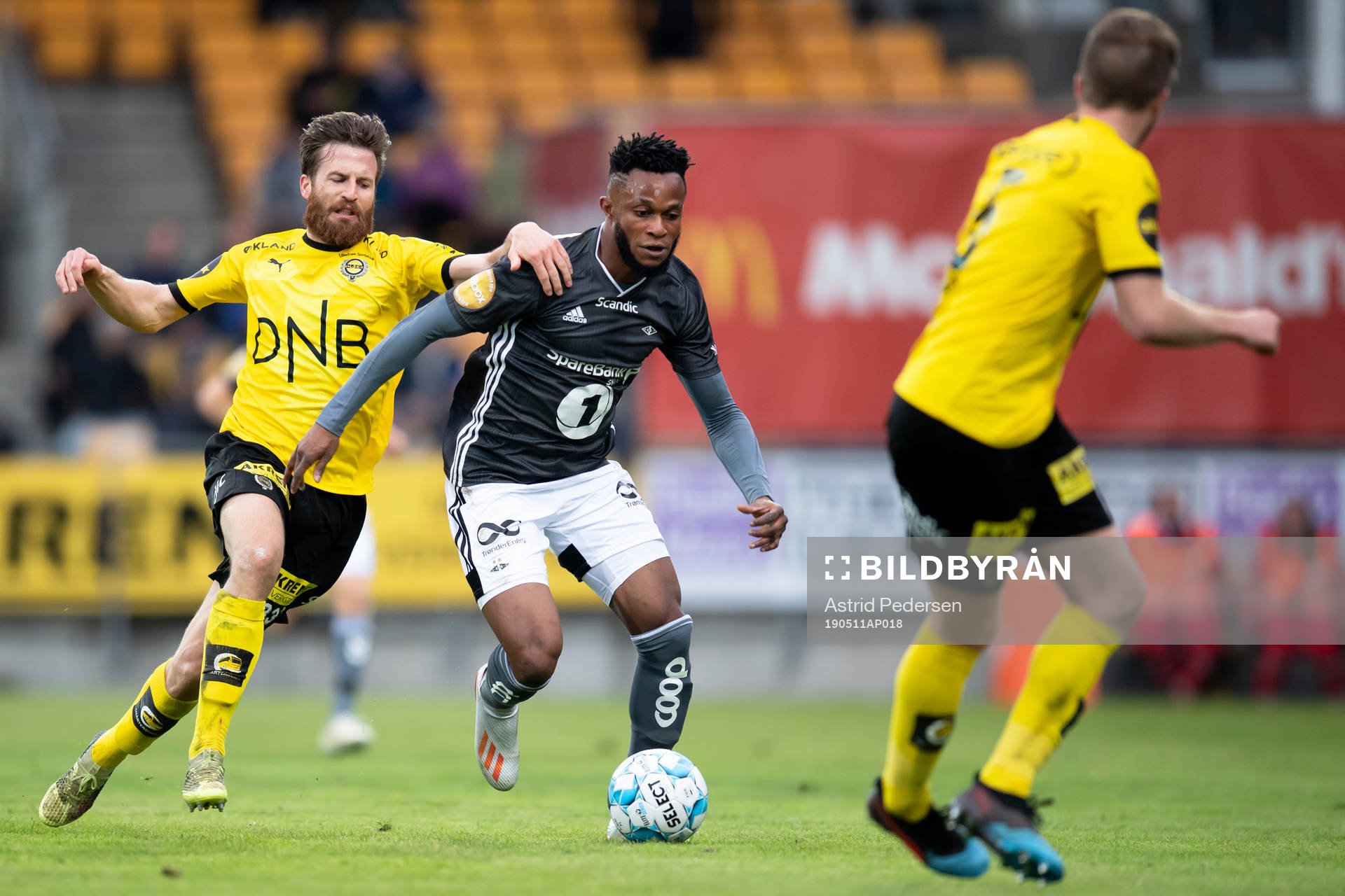 Aleksander Melgalvis of Lillestrøm and Samuel Adegbenro of