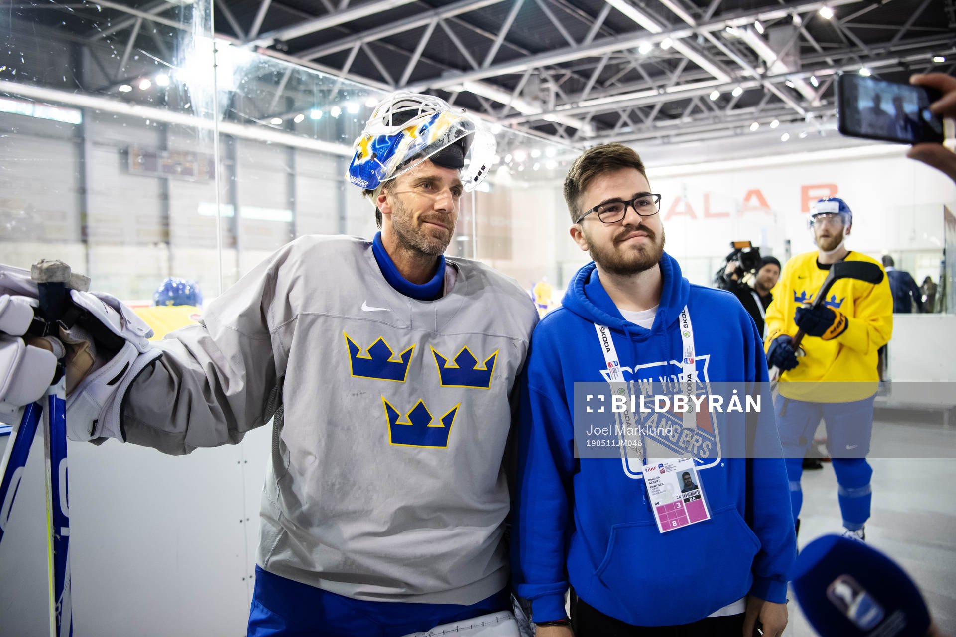 Goaltender Henrik Lundqvist of Sweden and a fan