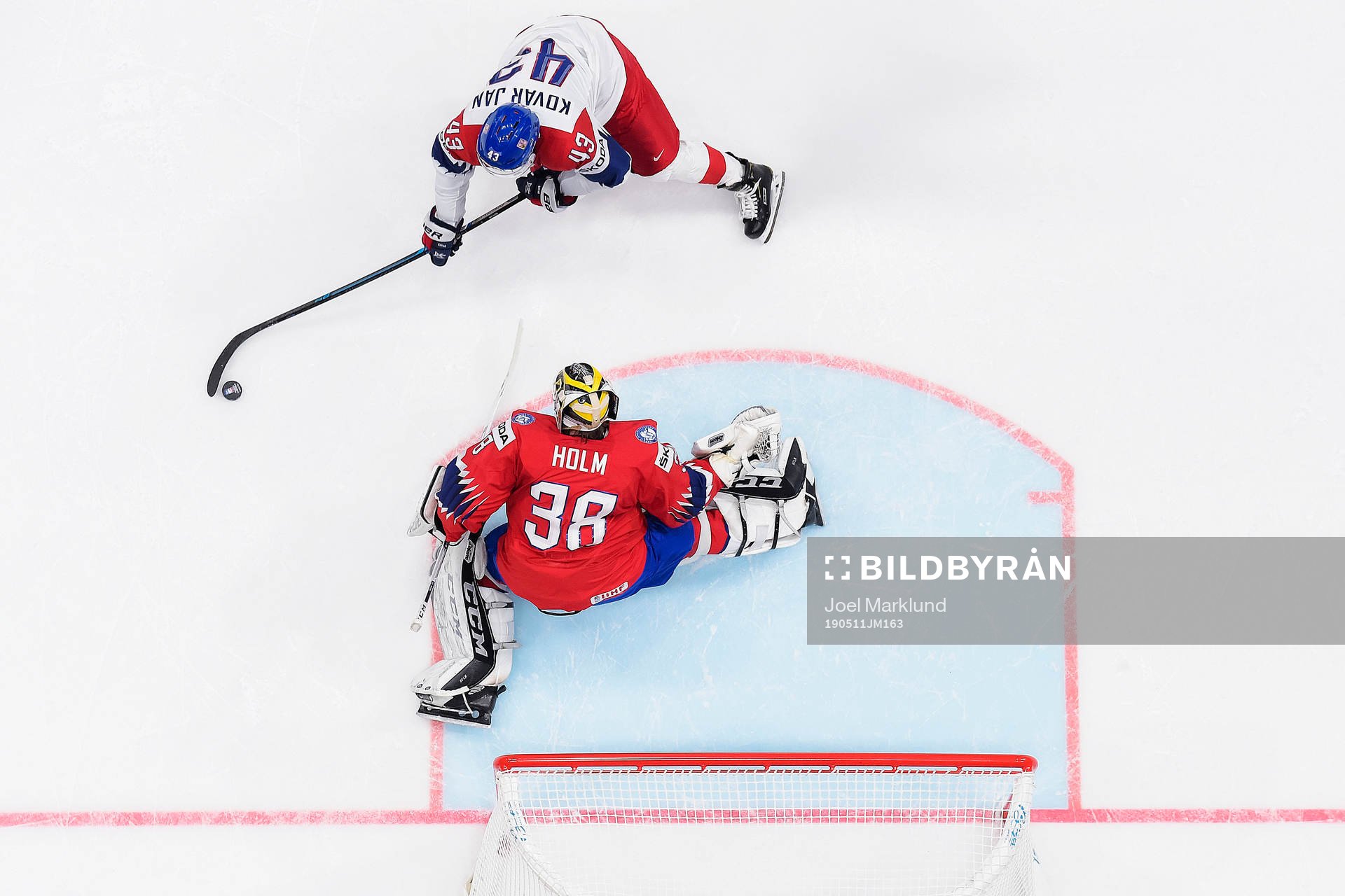 Jan Kovar of Czech Republic against goaltender Henrik Holm