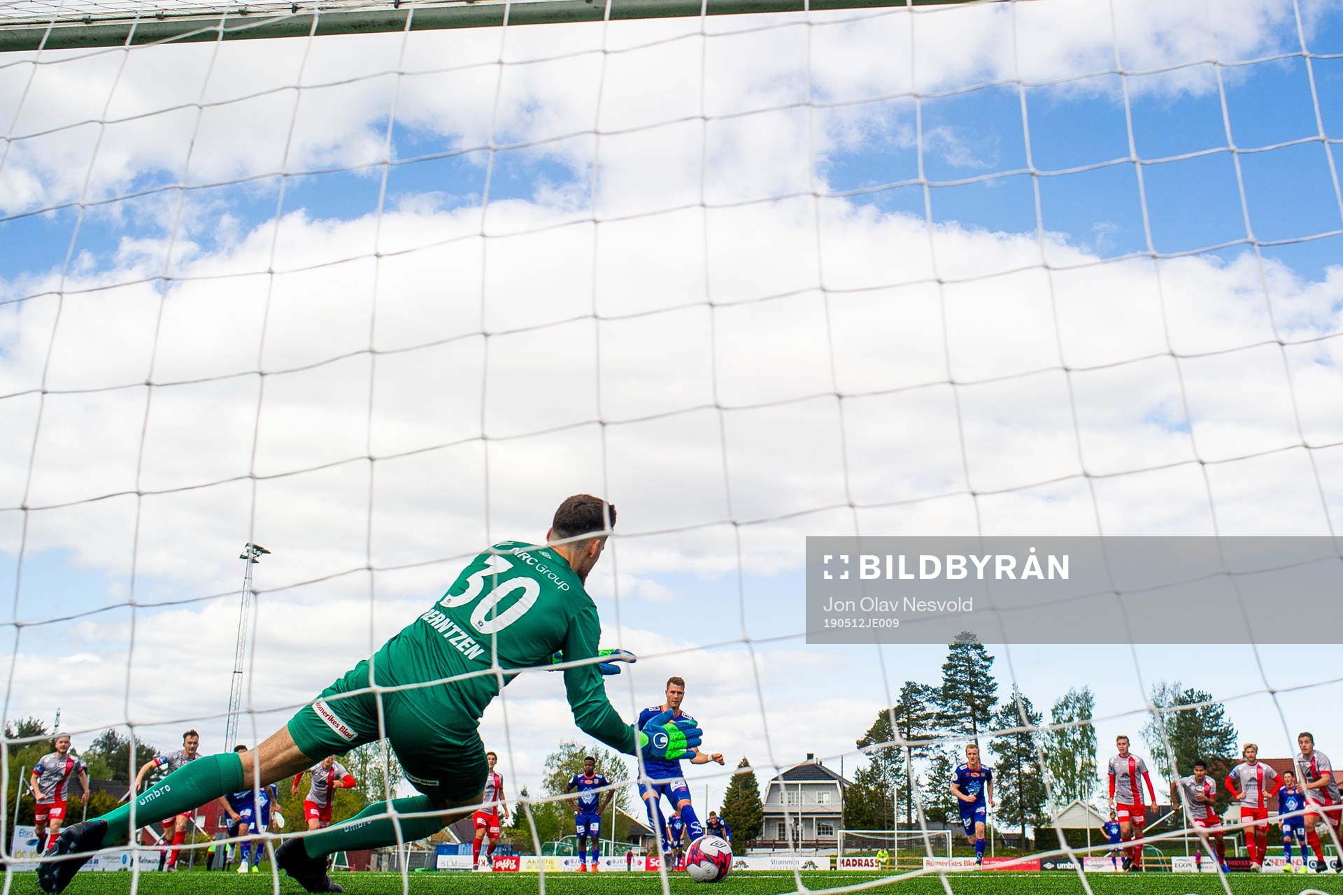 Goalkeeper Marius Berntzen of Strømmen saves a penalty