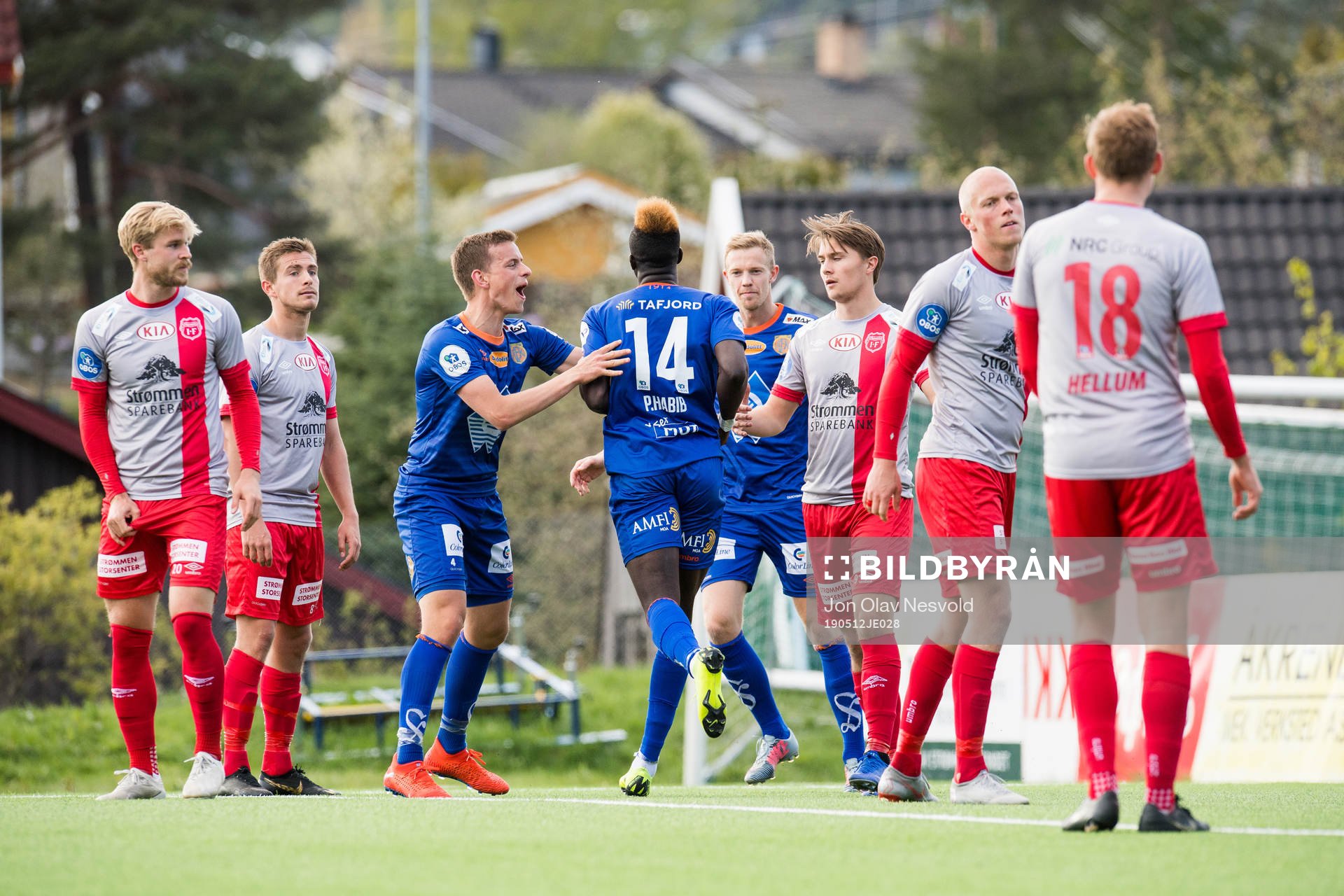 Pape Habib Gueye of Aalesund celebrates with teammates after scoring 0-2 during the OBOS-ligaen match between Strømmen and Aalesund on May 12, 2019 in Strømmen.