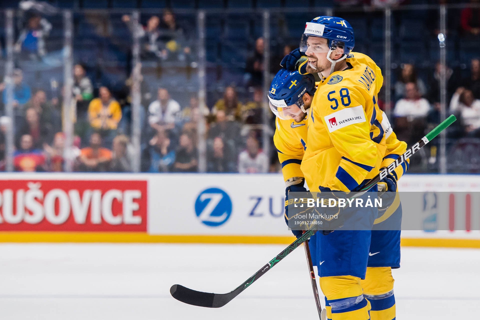 Oliver Ekman Larsson and Anton Lander of Sweden celebrates