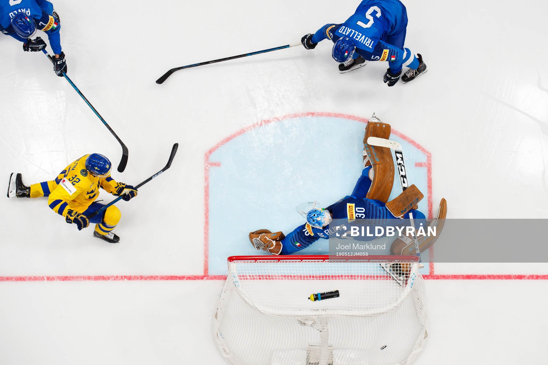 Oskar Lindblom of Sweden scores 0-3 behind goaltender Marco